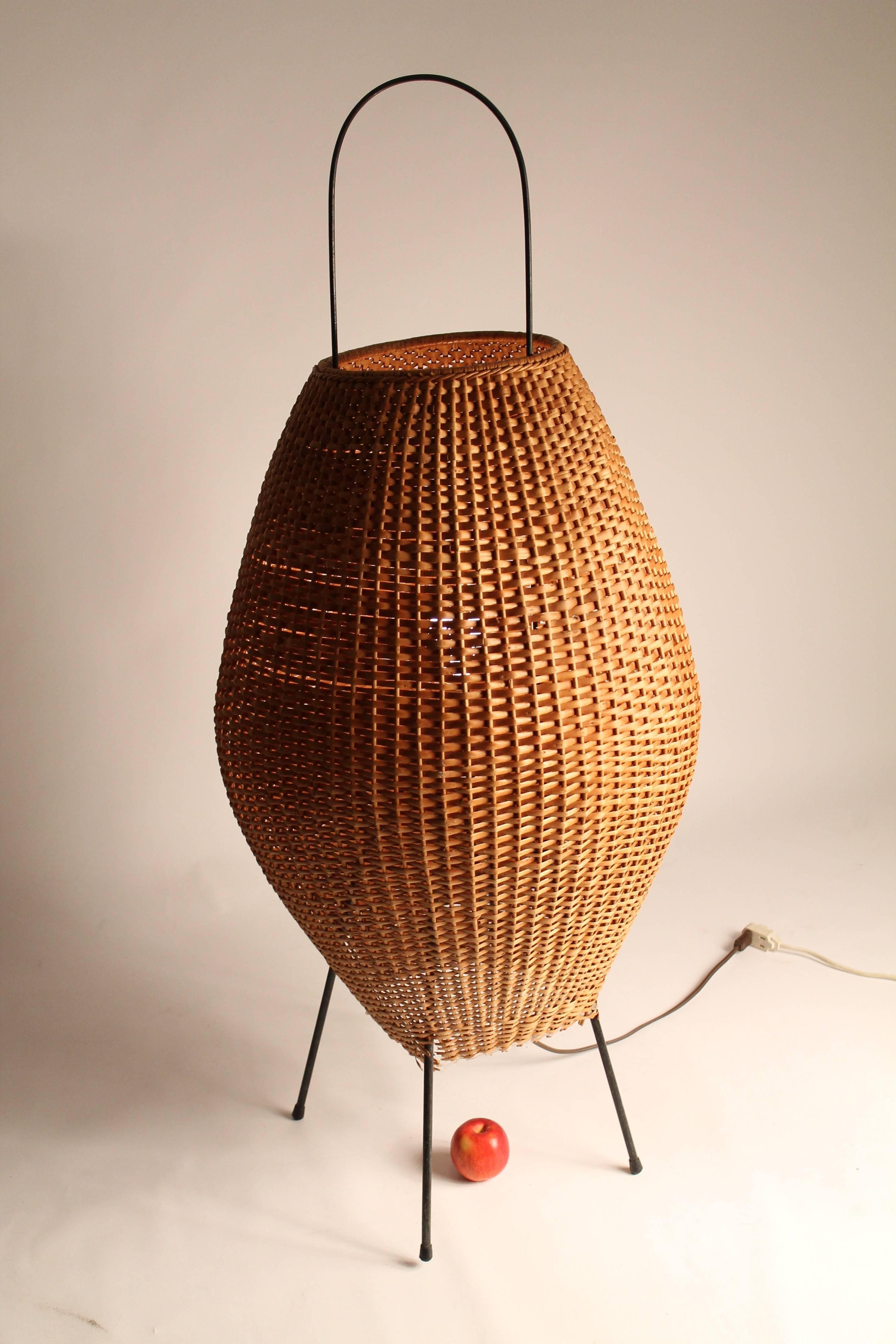 This Minimalist wicker floor lamp is bold, has presence and personality. 

Warm glow while lighted. 

Contain one regular E26 ceramic socket rated at 100 watts maximum . 

Mounted on steel rod frame (wrought iron),  with rubber tip . 

48
