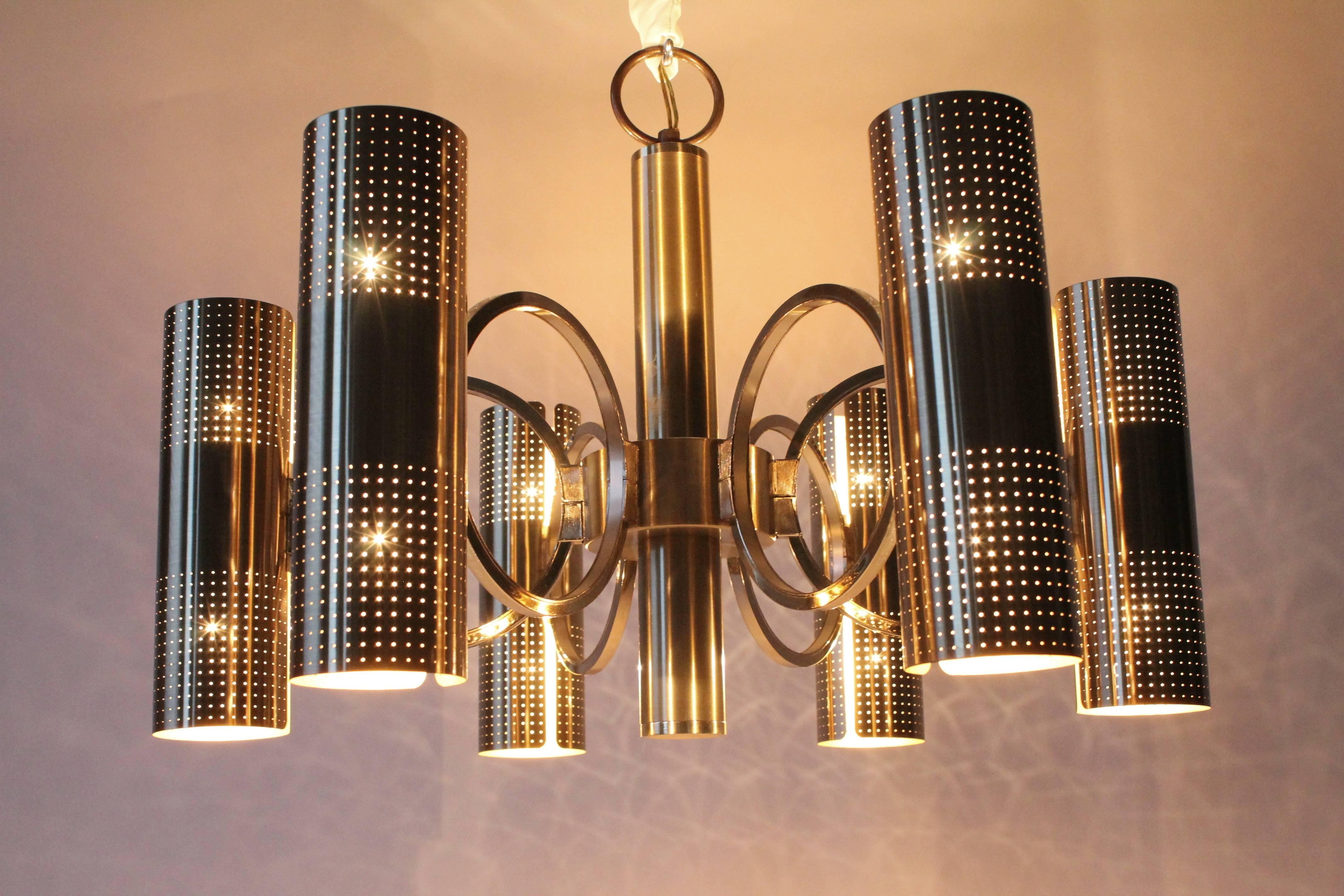Prime quality lacquered brass with needle tips size perforated holes on shade. 

Well made, solid construction. 

Six upward and six downward firing light bulbs with regular E26 size socket.

Measure 22 inches wide by 16 inches high.

Actual