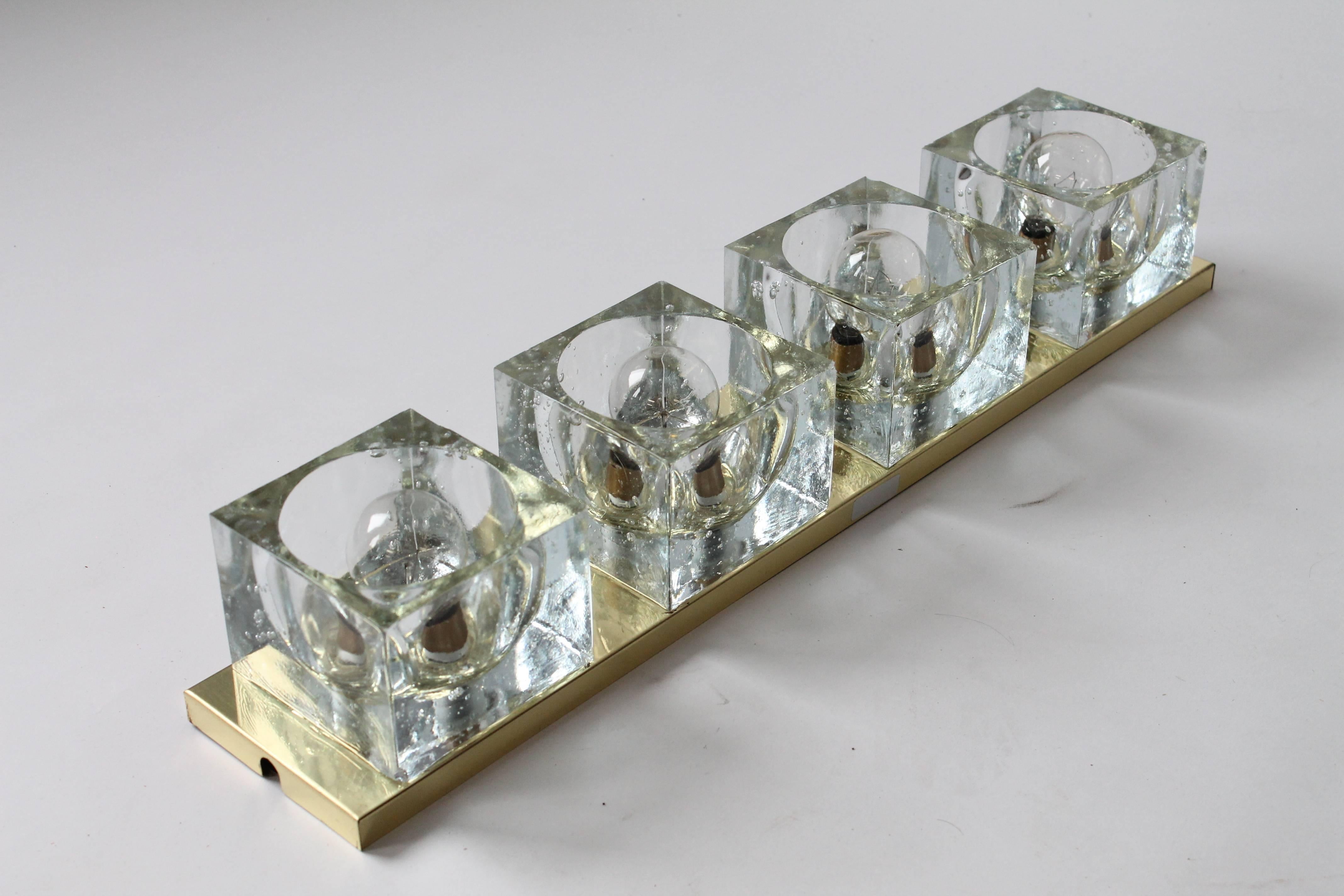 Light bounce everywhere on these big chunky thick glass cubes. 

Hand casted , full of lovely imperfection and air bubble. 

Weight 12 pounds per fixture. 

Often use as vanity light. 

Measure: 24 inches long by 4.5 inches wide.