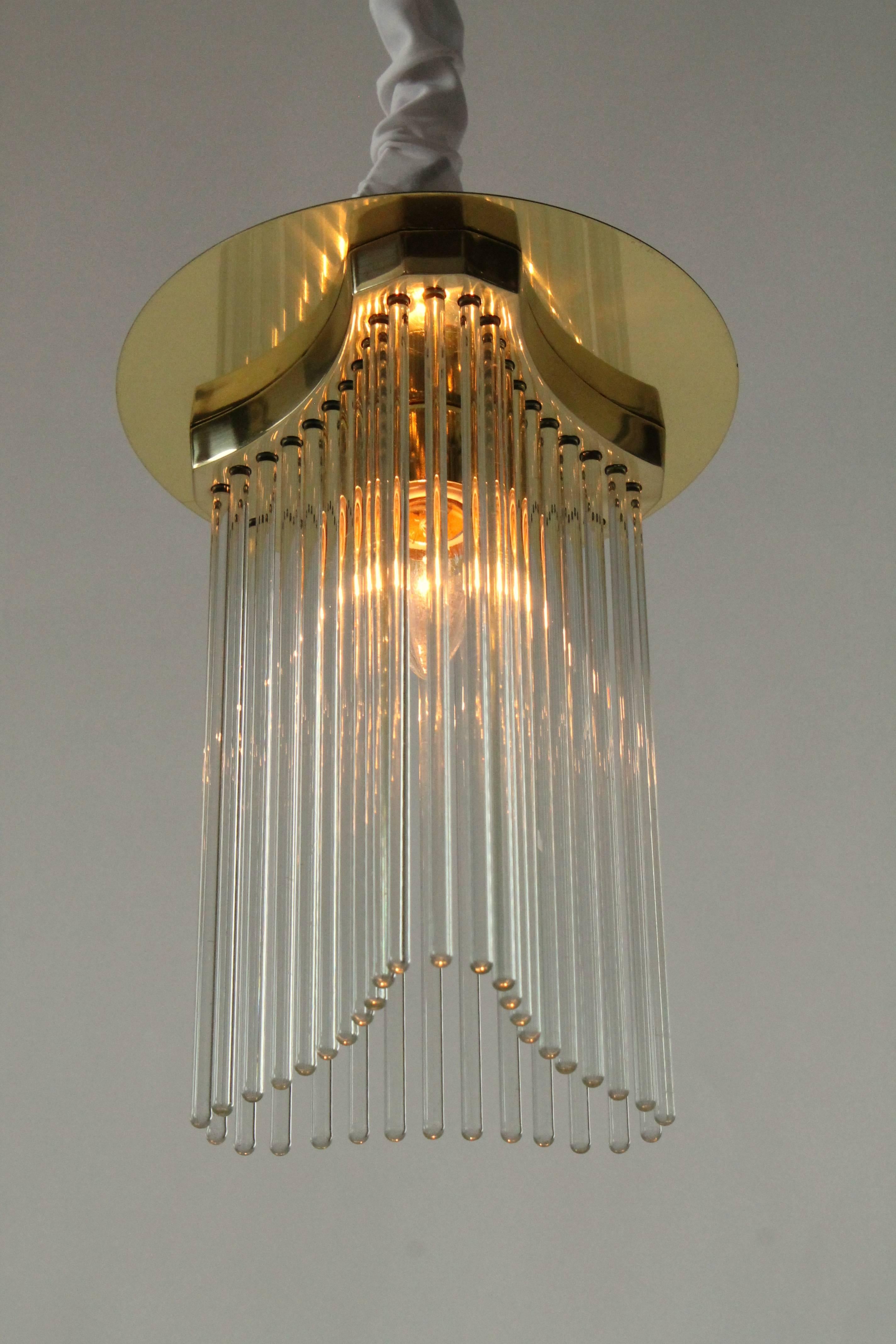 Flush mount with solid brass glass rod support and brass plated canopy   

Solid, sturdy construction.

Made with prime quality material and excellent craftmanship by Lightolier. 

One E26 socket rated at 60 watt. 

Measure inches 12 high.
  