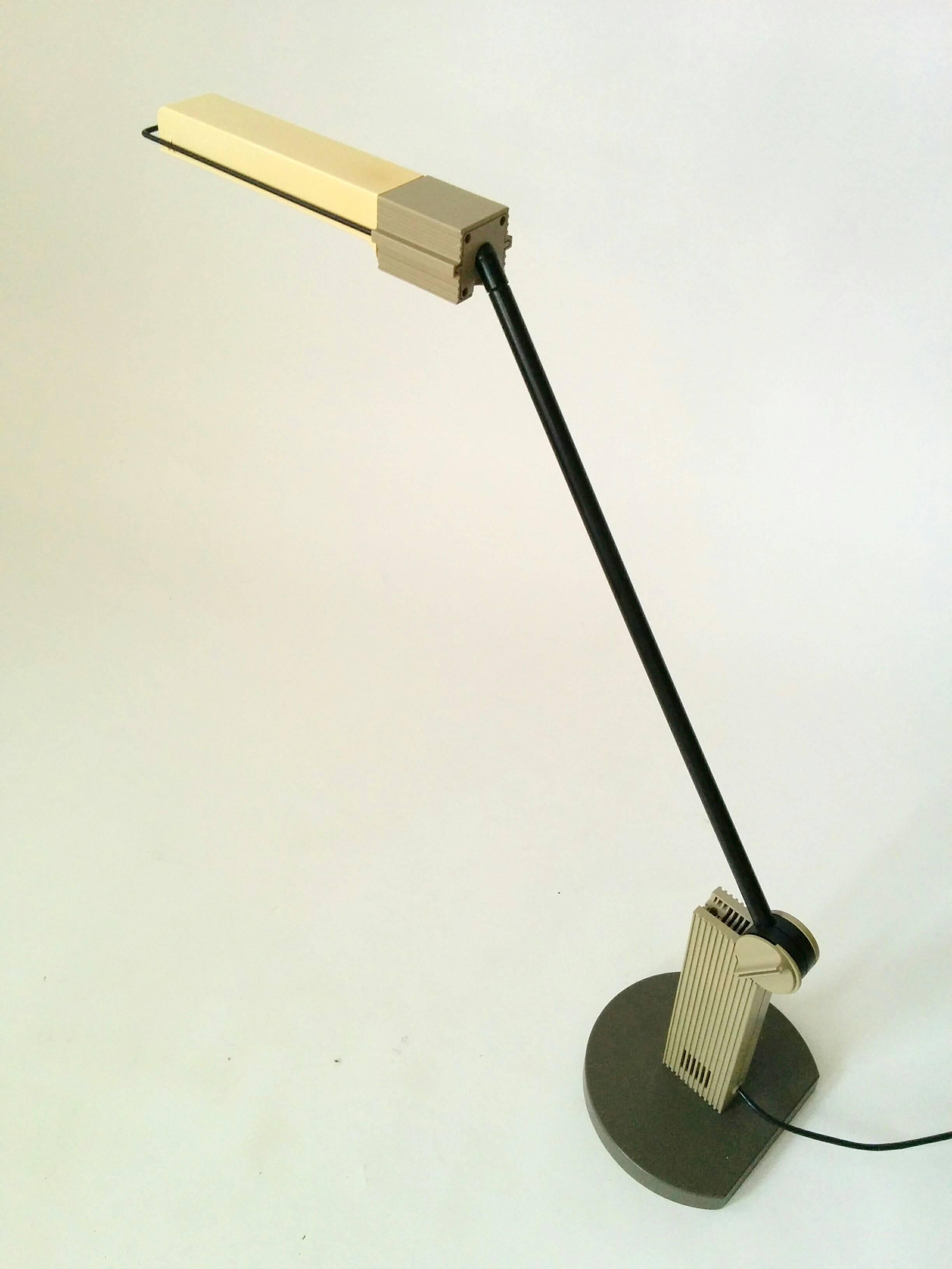 Agile fluorescent work table lamp that goes in all direction. 

Arm measure in a straight horizontal position 35 inches long with shade. 

ON/OFF switch on rotating base.

