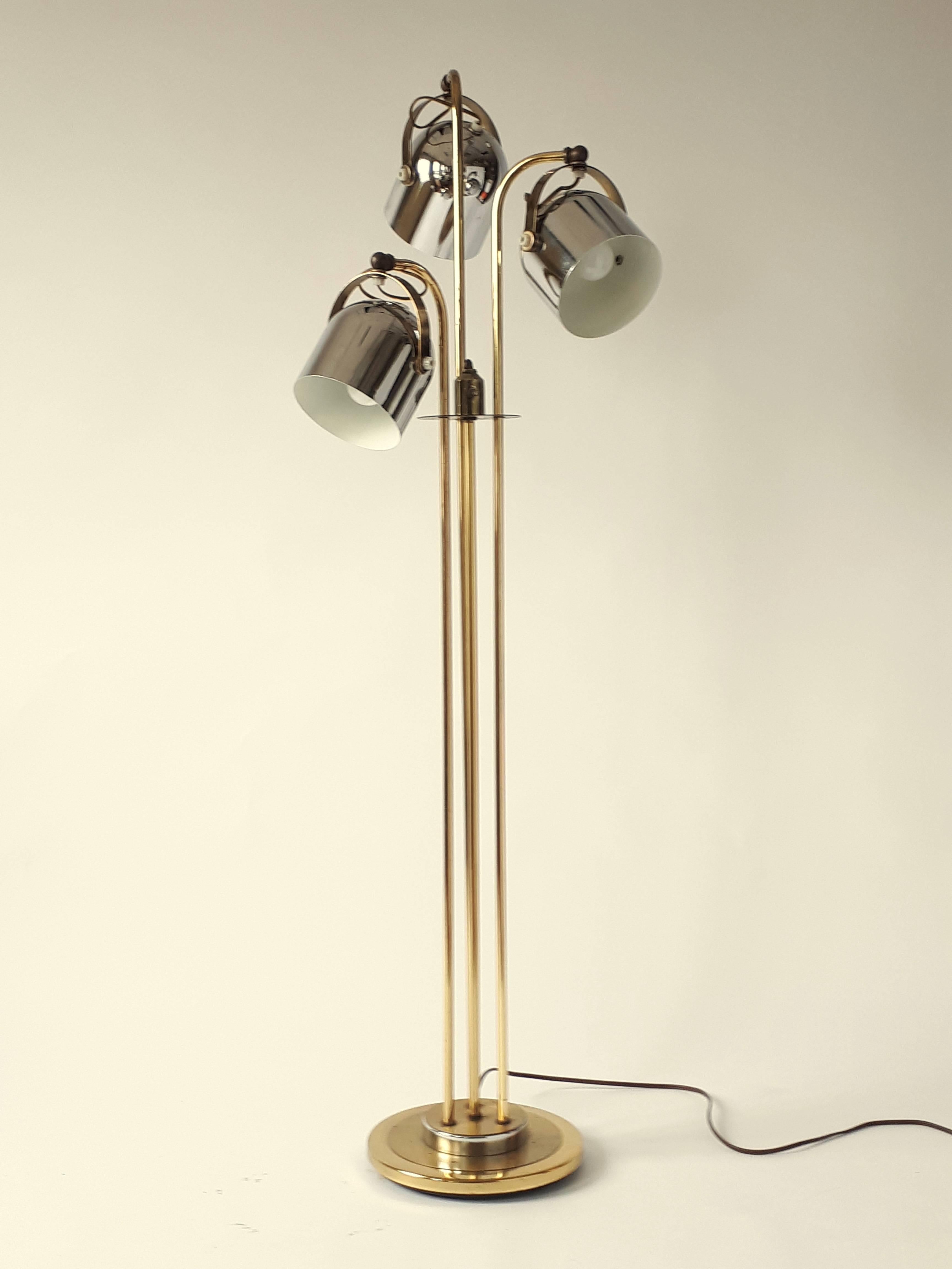 Brass plated structure and hardware.

Chrome stirrup and vented shade. 

Measure 51 inches high.
 