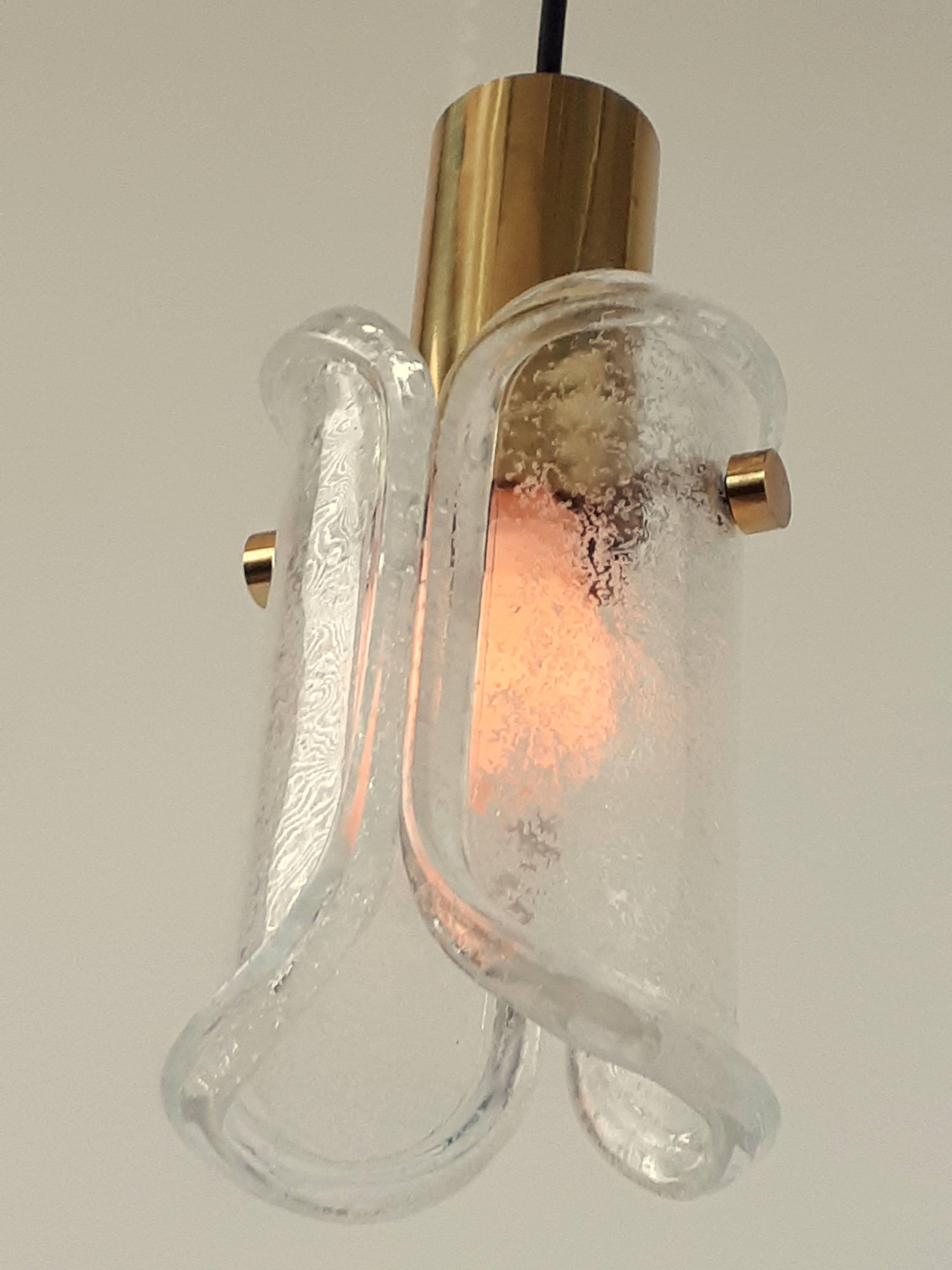 Extra thick mouthblowed glasswork full of small bubble mounted on a brass fixture. 

Solid, sturdy construction.

Well made with prime quality material and hardware. 

One socket rated at 60 watts.

Come with black canopy and 5 feet of cord.
 