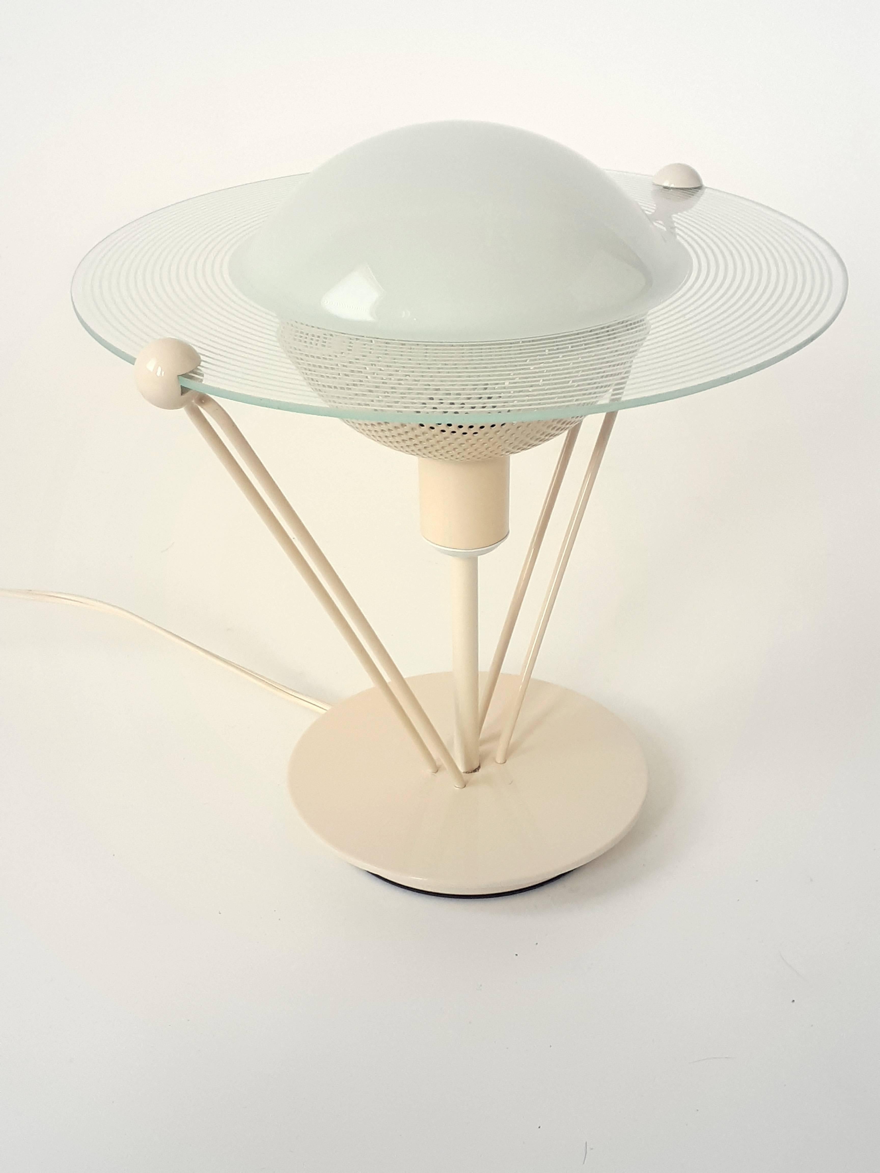 Solid, well made enameled beige metal base and structure topped by a Saturn shaped glass.

Measure 10.5 inches high. 

Contain one E12 candelabra size light bulb rated at 60 watts max. 

Switch on cord.

Only one left .