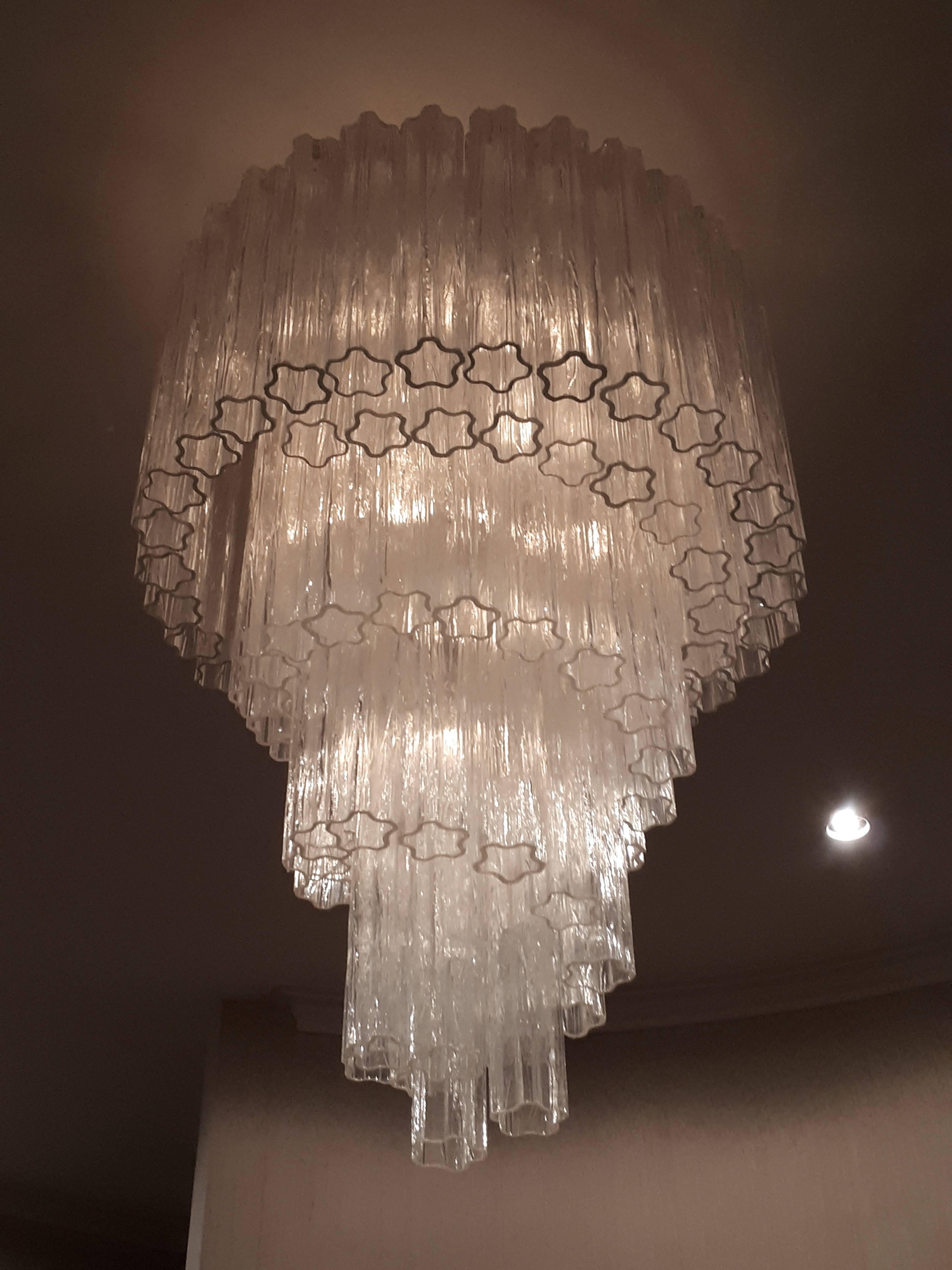 Original huge sculptural chandelier made of thick texturized  clear glass pieces .

Each shade measure 16 inches in lenght . 

Frame is enameled bone  white. 

Measure 52 inches high by 31 inches wide. 

Contain 10  regular size E26 ceramic socket