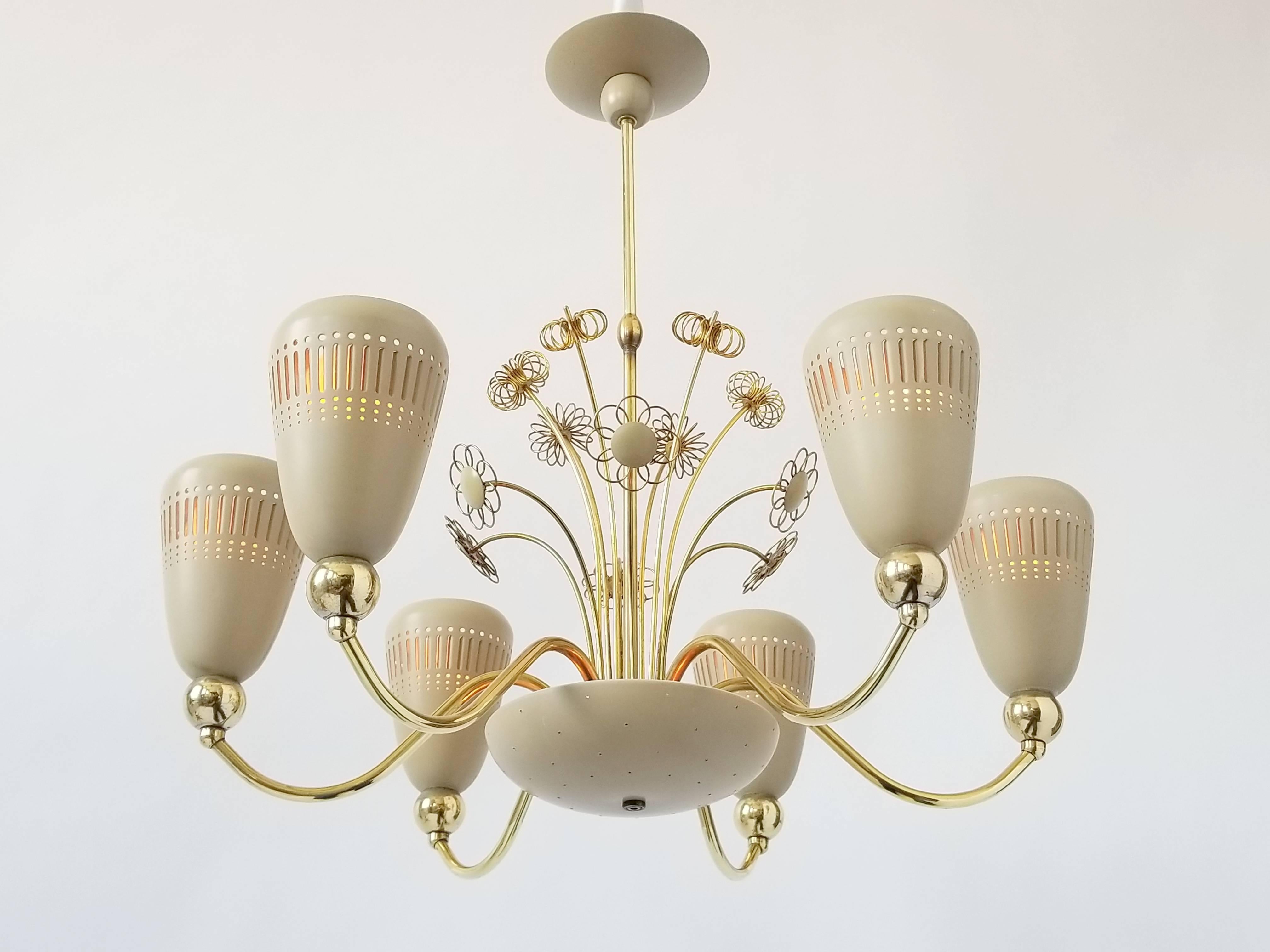 Paavo Tynell collaborated for Lightolier in the 1950s and we certainly could feel is input into this rare model.

Similar to the Ballerina series from Lightolier, this chandelier has a few unique variations that set it apart with the differently