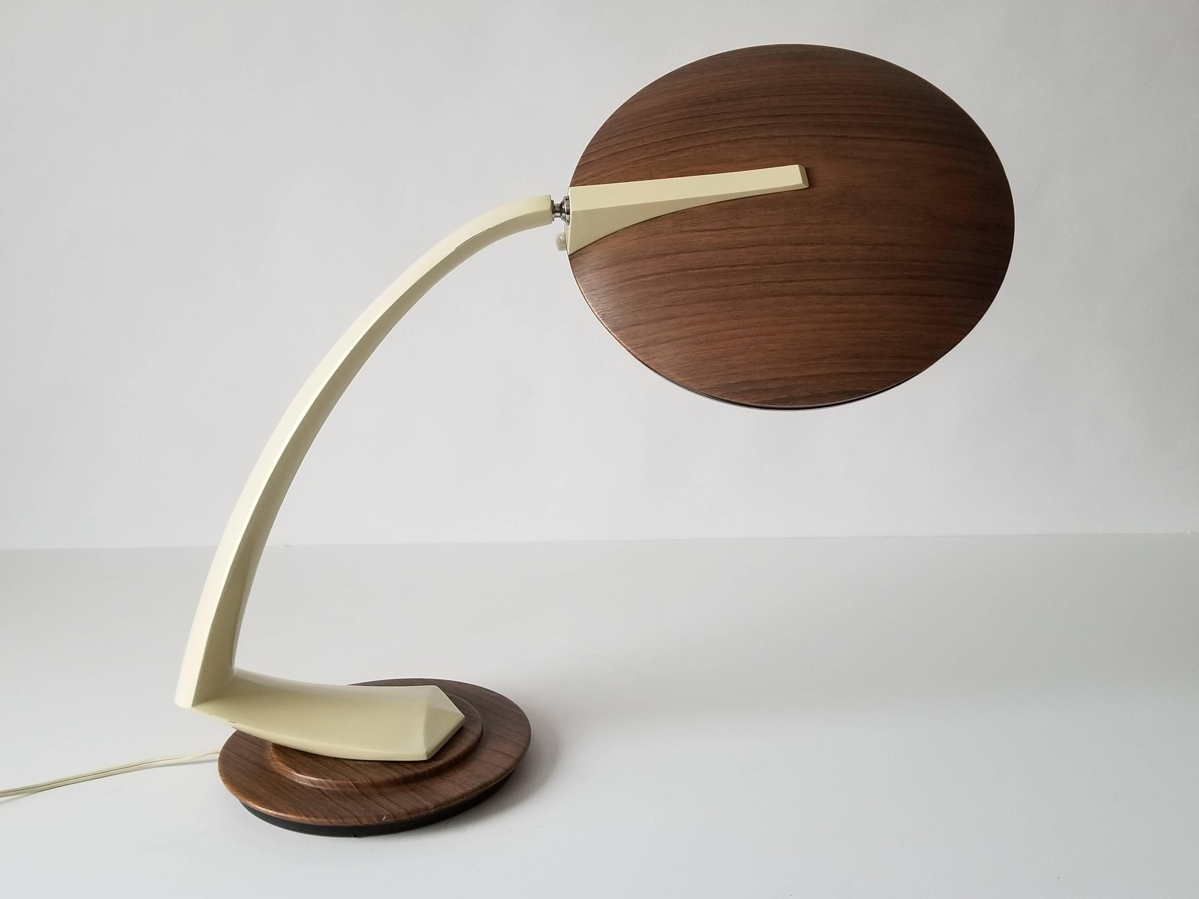 Space Age design Fase table lamp from the 1960s. 

Original wood grain motif finish. Enameled arm. 

Very agile shade positioning and base rotate 360 degree . 

Well made with prime quality material. 

Extremely solid construction . 

Depolished