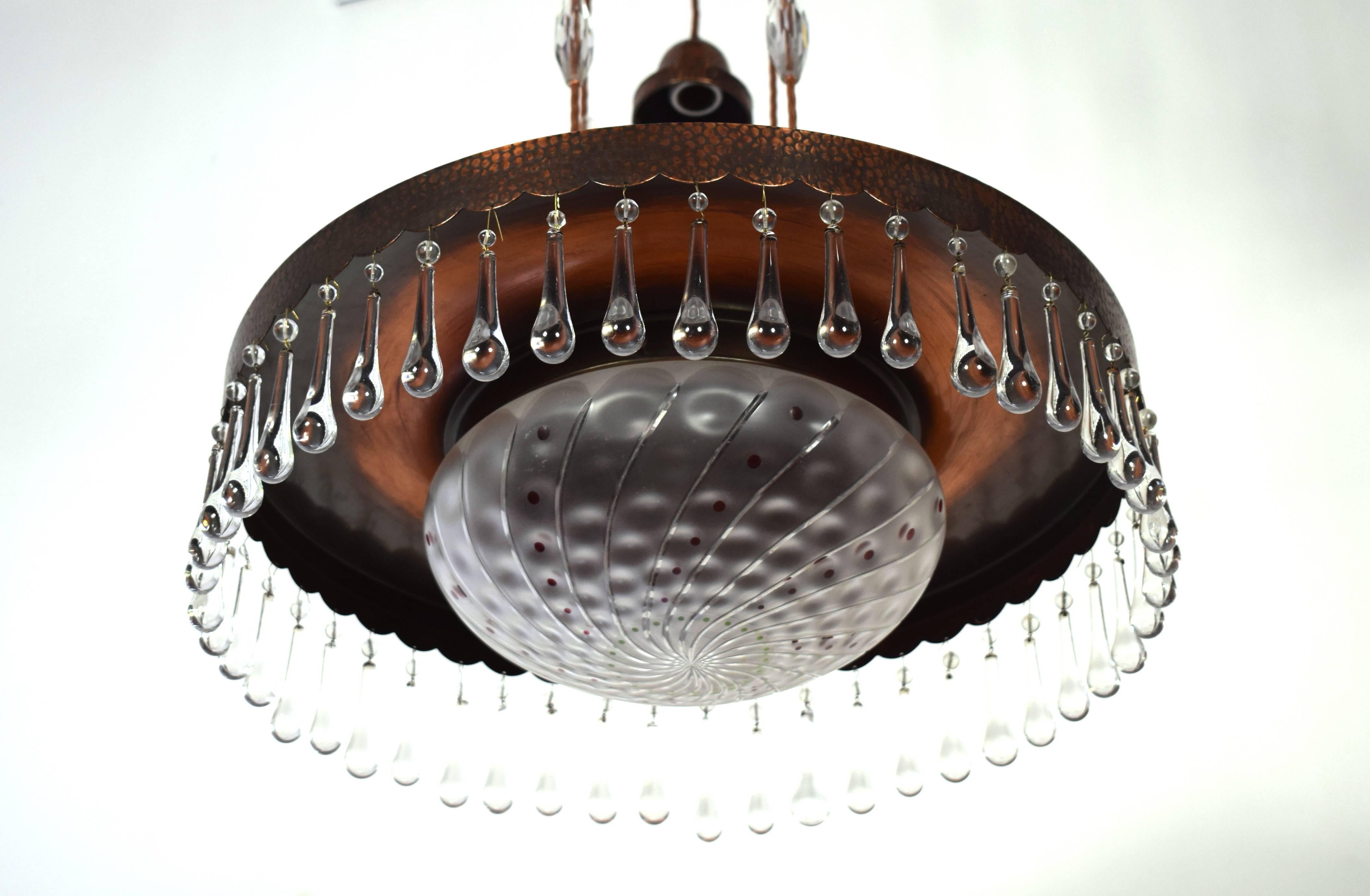 Vienna Secession chandelier with two handblown opalescent glass shades hanging from a decorative round dish in bronze.
Two opaline glass lamp shades. The glass shades were obtained and from Bohemian glass manufacturers, amongst them also the