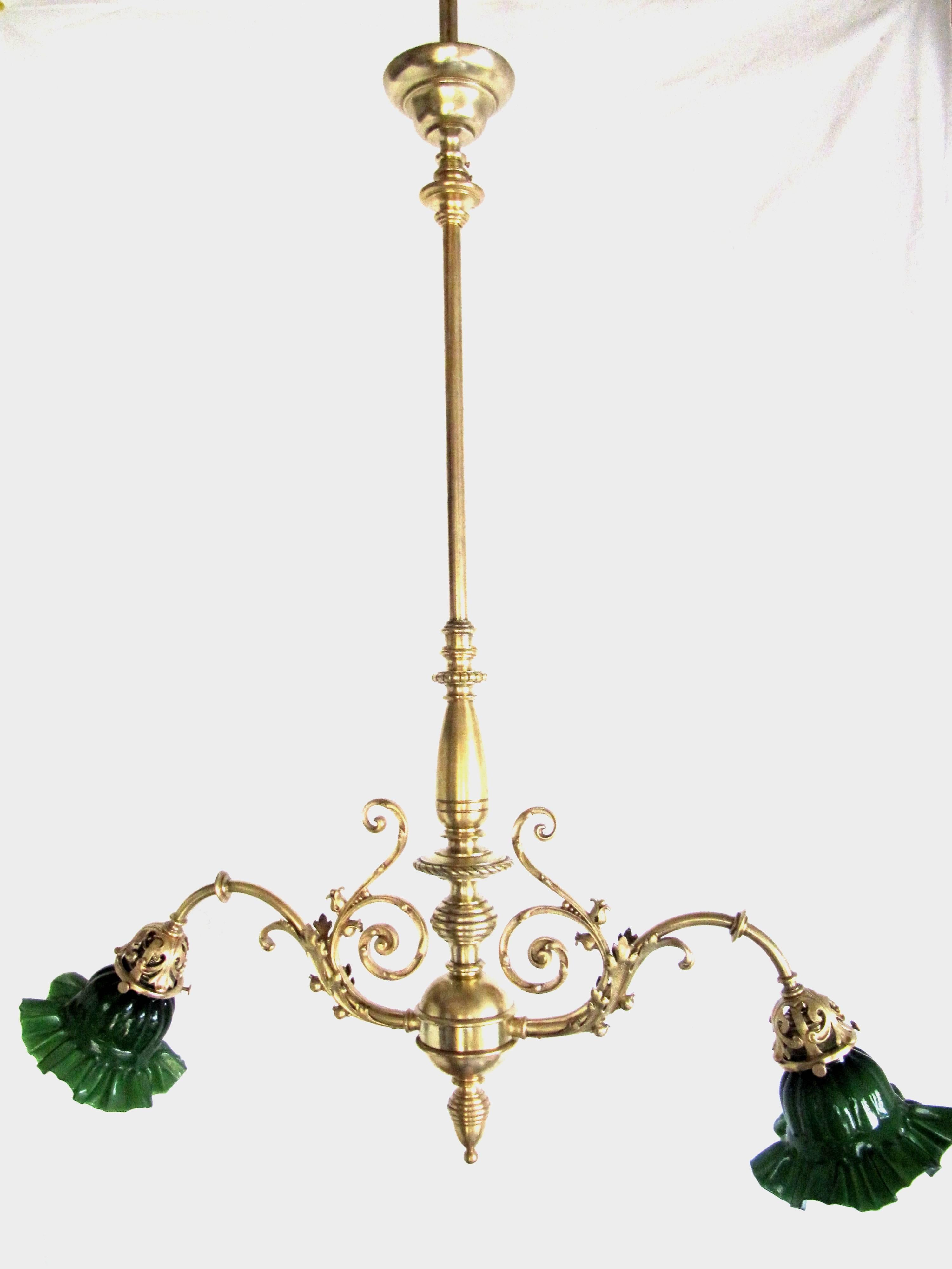 Typical Viennese chandelier from the period the Vienna Ringstrasse (built 1860-1910).
Solid gold plated double-lamp ceiling lamp. Green cased glass lampshades. Restored condition!
