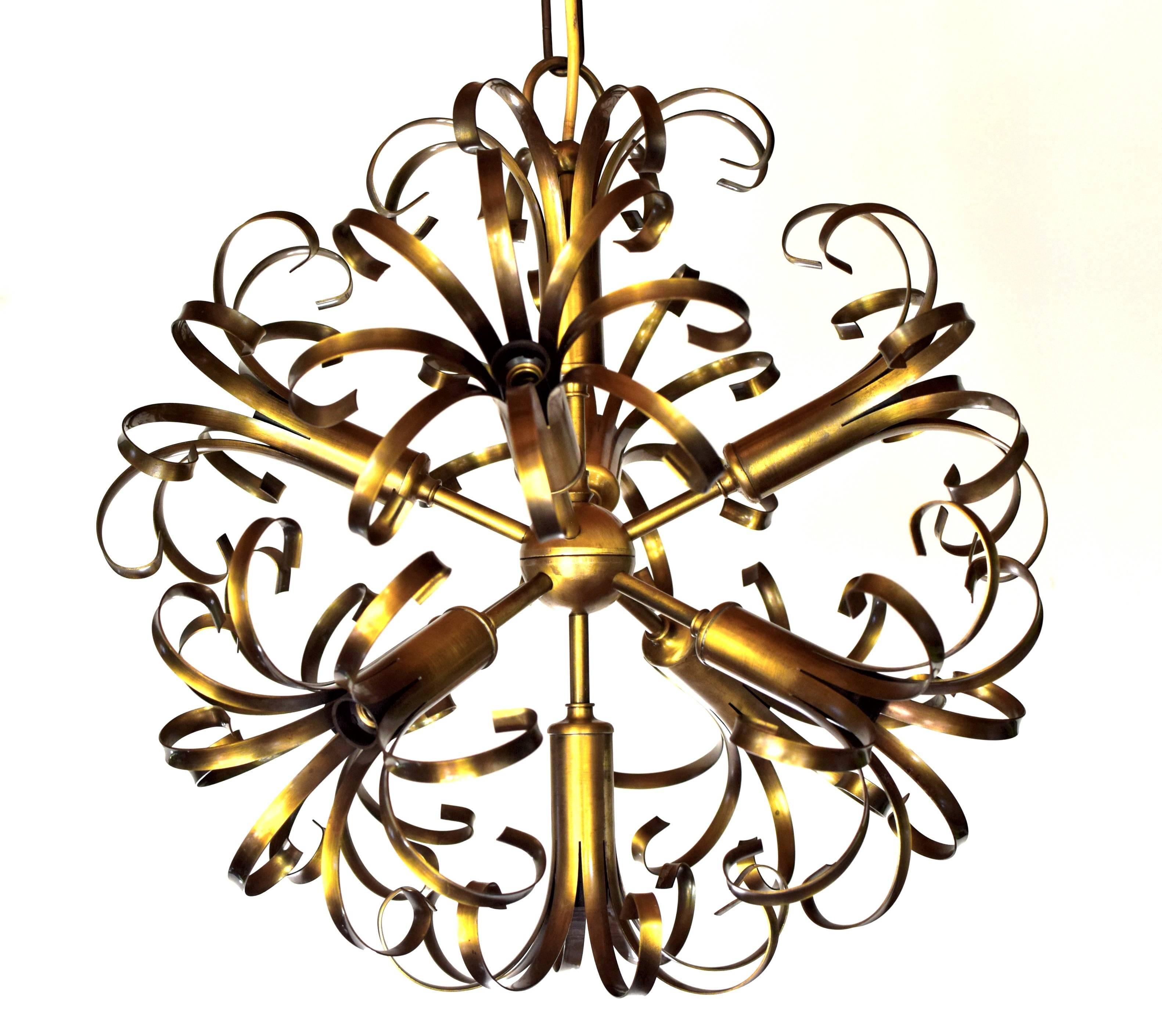 Beautiful Italian Sputnik ceiling lamp.
Nine bulbs (E14 sockets), ten arms.
Rare variant in solid brass (burnished).

Very good original condition.

Measures: Diameter 48 cm,
heigth 137 cm, chain can be shortened as desired

A total of