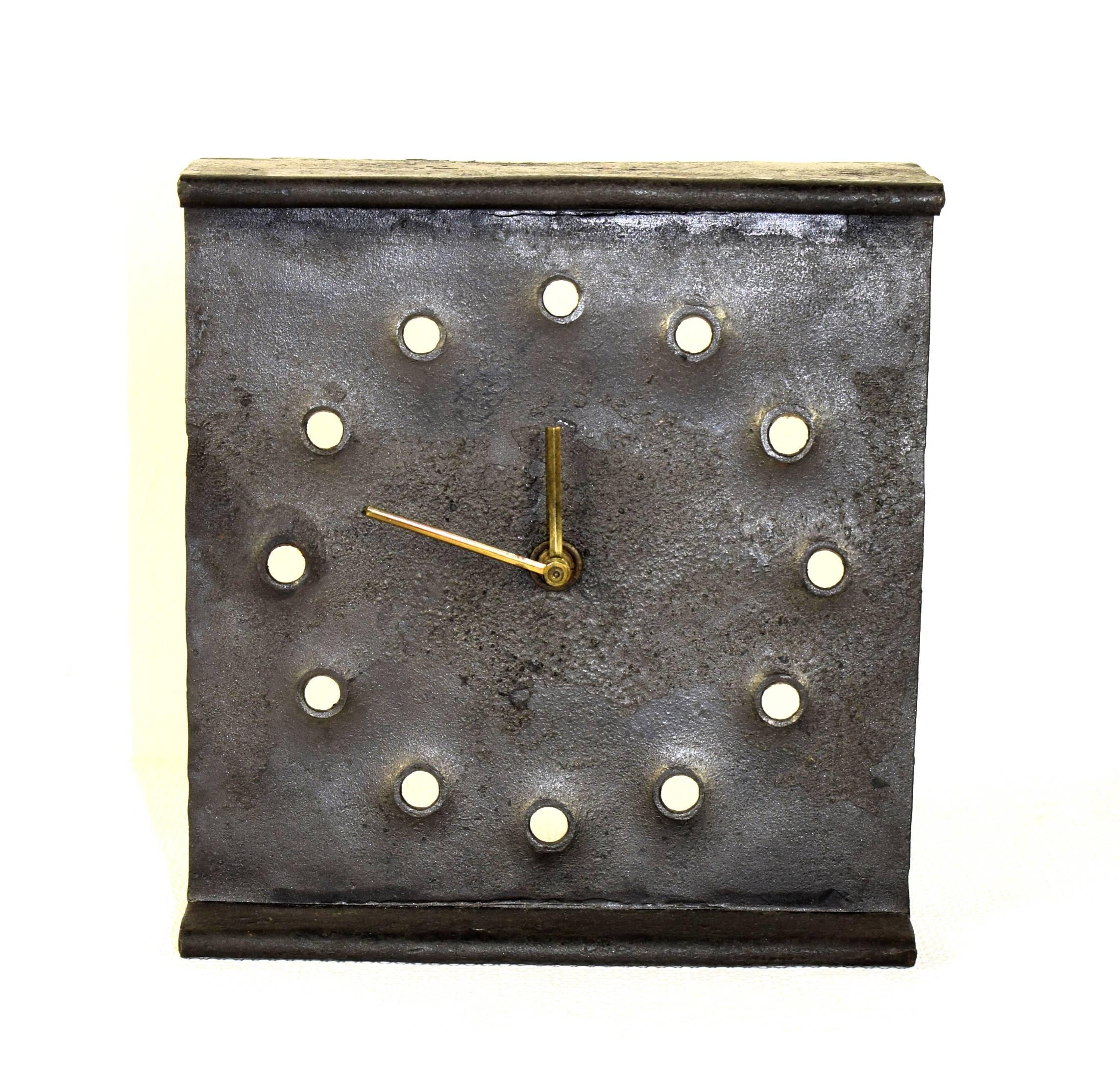 Large table clock made of a thick steel sheet - handwork!
Works perfectly. Very good condition. 
Measurements: 18 cm wide, 20cm high.
