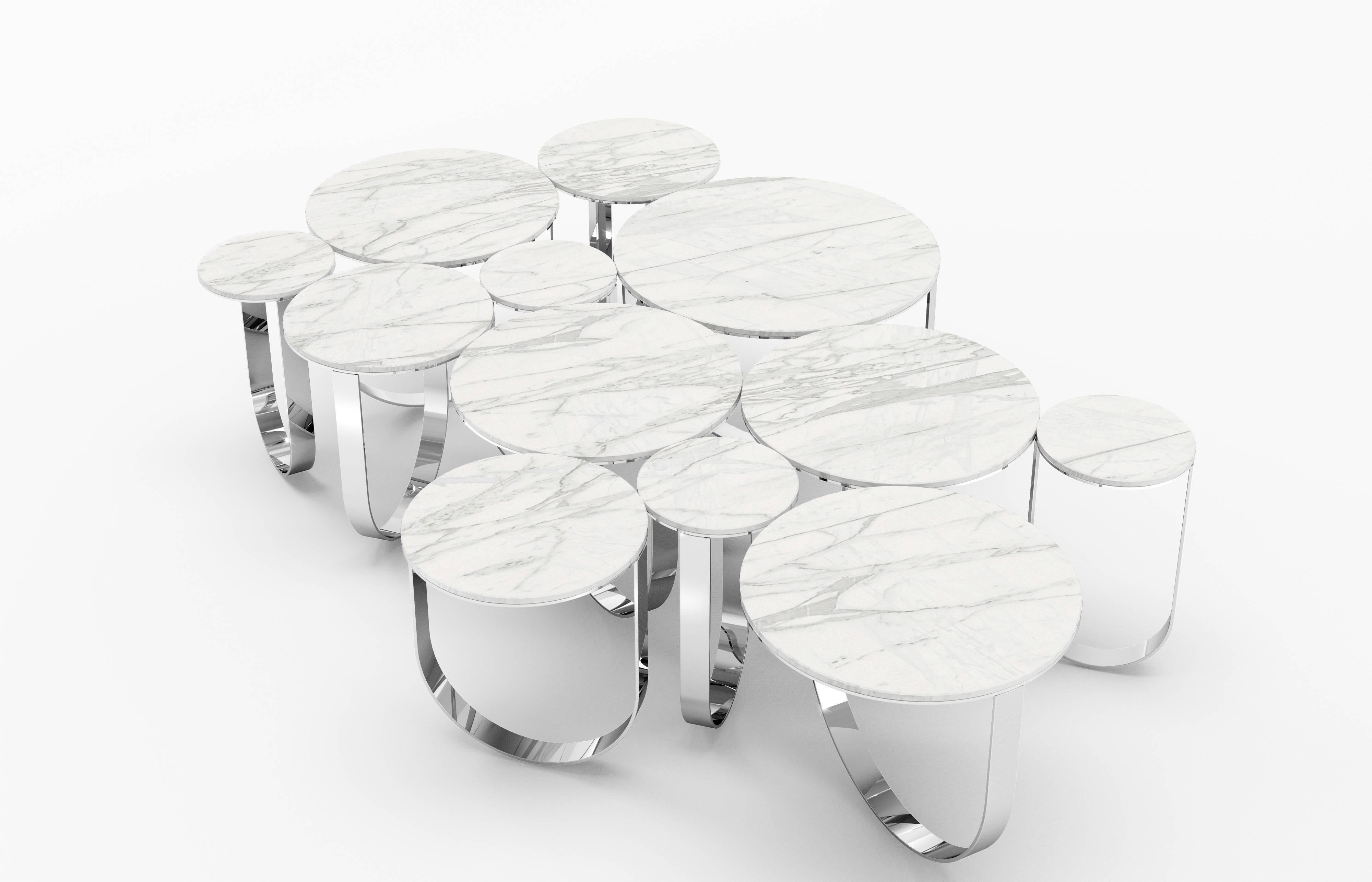 The 'Cloud' is a spectacular coffee table with structure in mirror polished stainless steel and top in statuary marble (origin: Tuscany). The mirror-like finishing of the stainless steel creates different perceptions of this particular material and