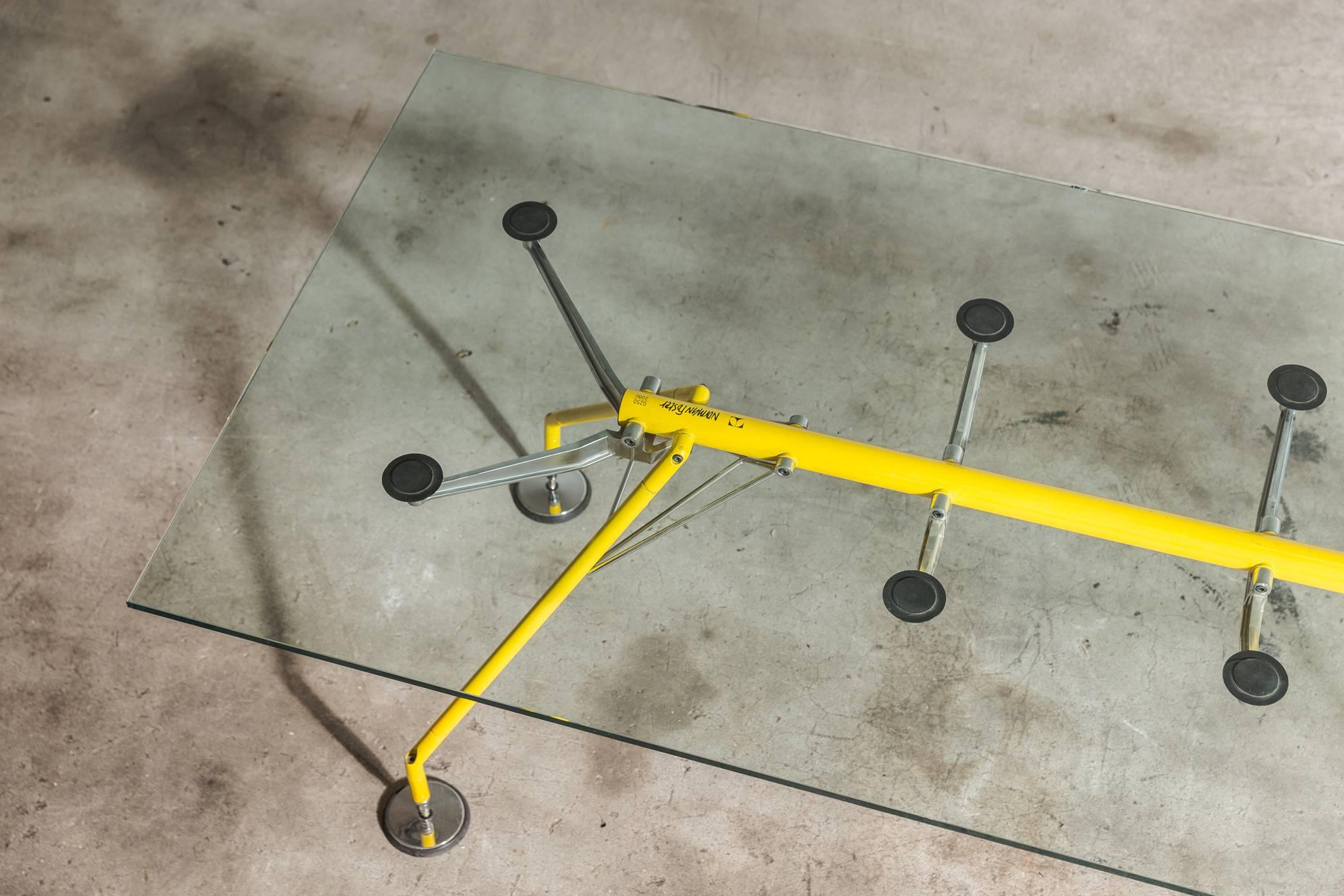 Dining table, conference table or desk named Nomos, designed by Sir Norman Foster, United Kingdom, 1986 and manufactured by Tecno, 1986. This version in Yellow was part of a limited Edition series and is super rare. This iconic design piece has won