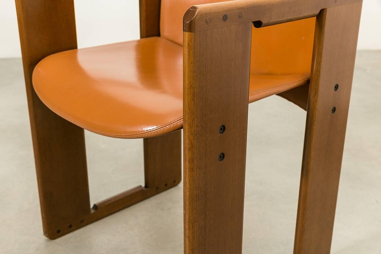 Beautiful set of six "Dialogo" dining chairs by Afra & Tobia Scarpa for B&B Italia. The Legs are made of walnut timber and the seat and backrest in original leather.