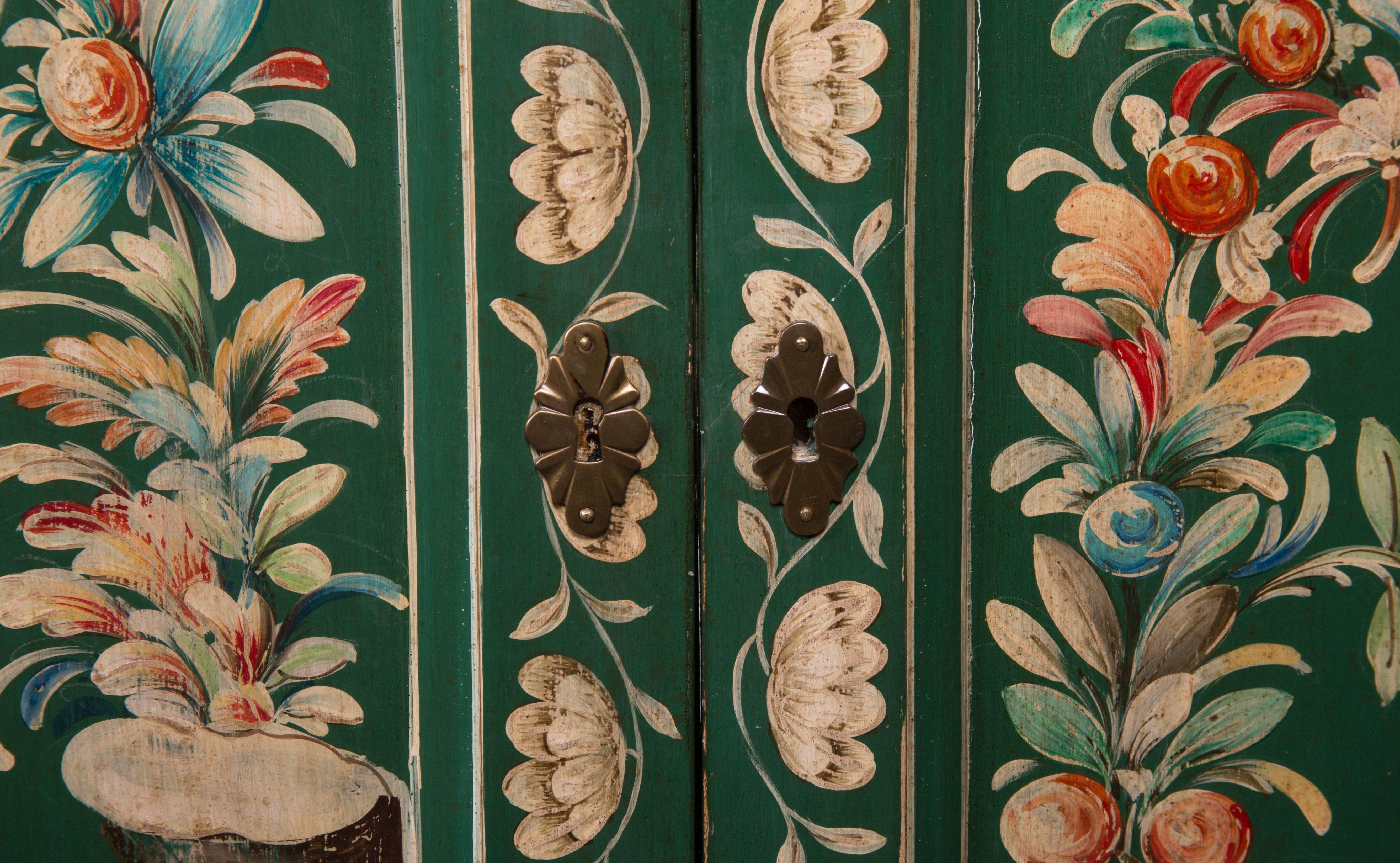 English forest green breakfront credenza with cabinet doors and sides painted over-all with colorful chinoiserie, raised on bun feet, circa 1950.