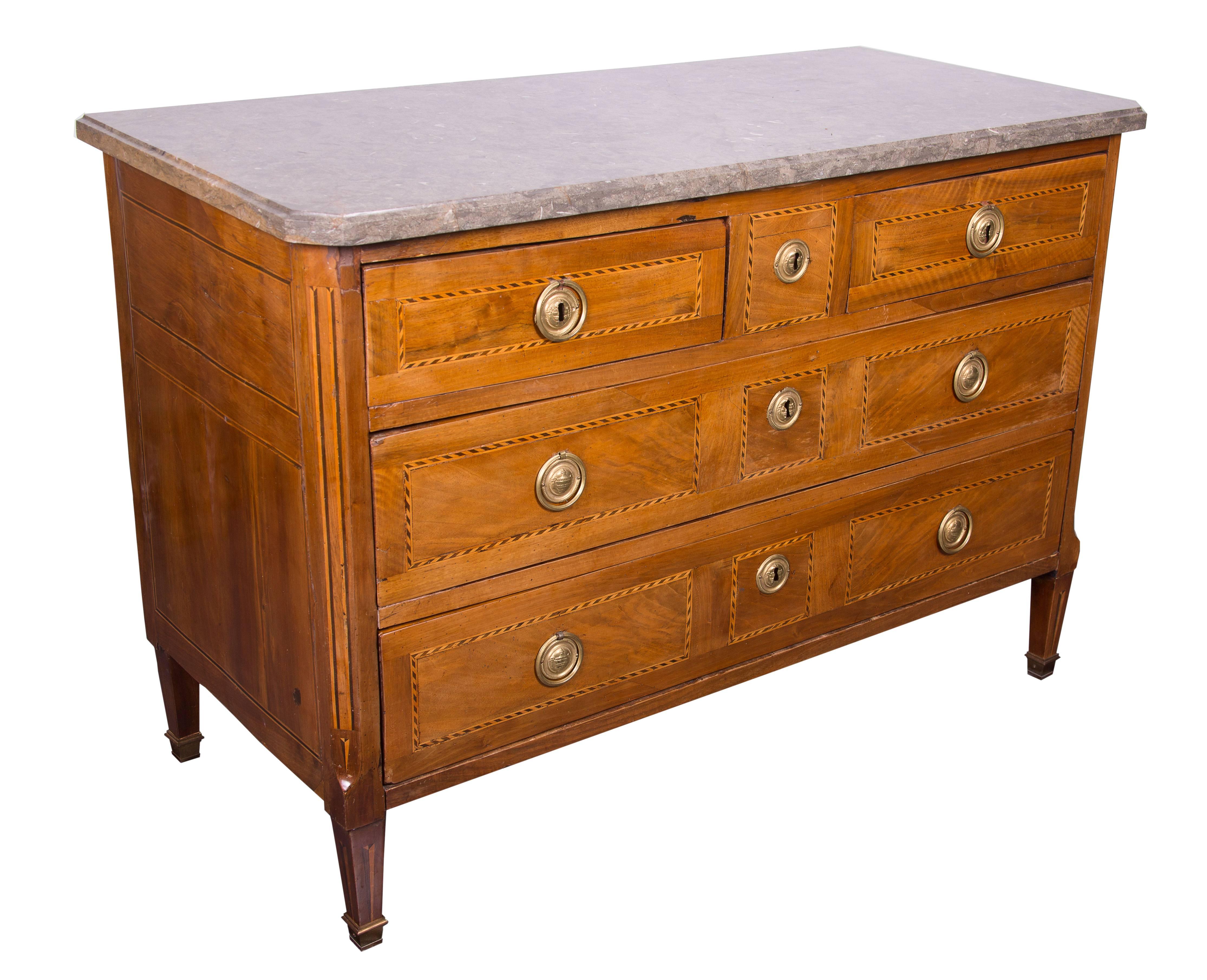 18th century Italian neoclassic walnut and fruitwood commode with a delicate inlaid design. The rectangular marble top over two short drawers and two long drawers inlaid with satin and walnut woods. Raised on straight tapering legs with brass caps.