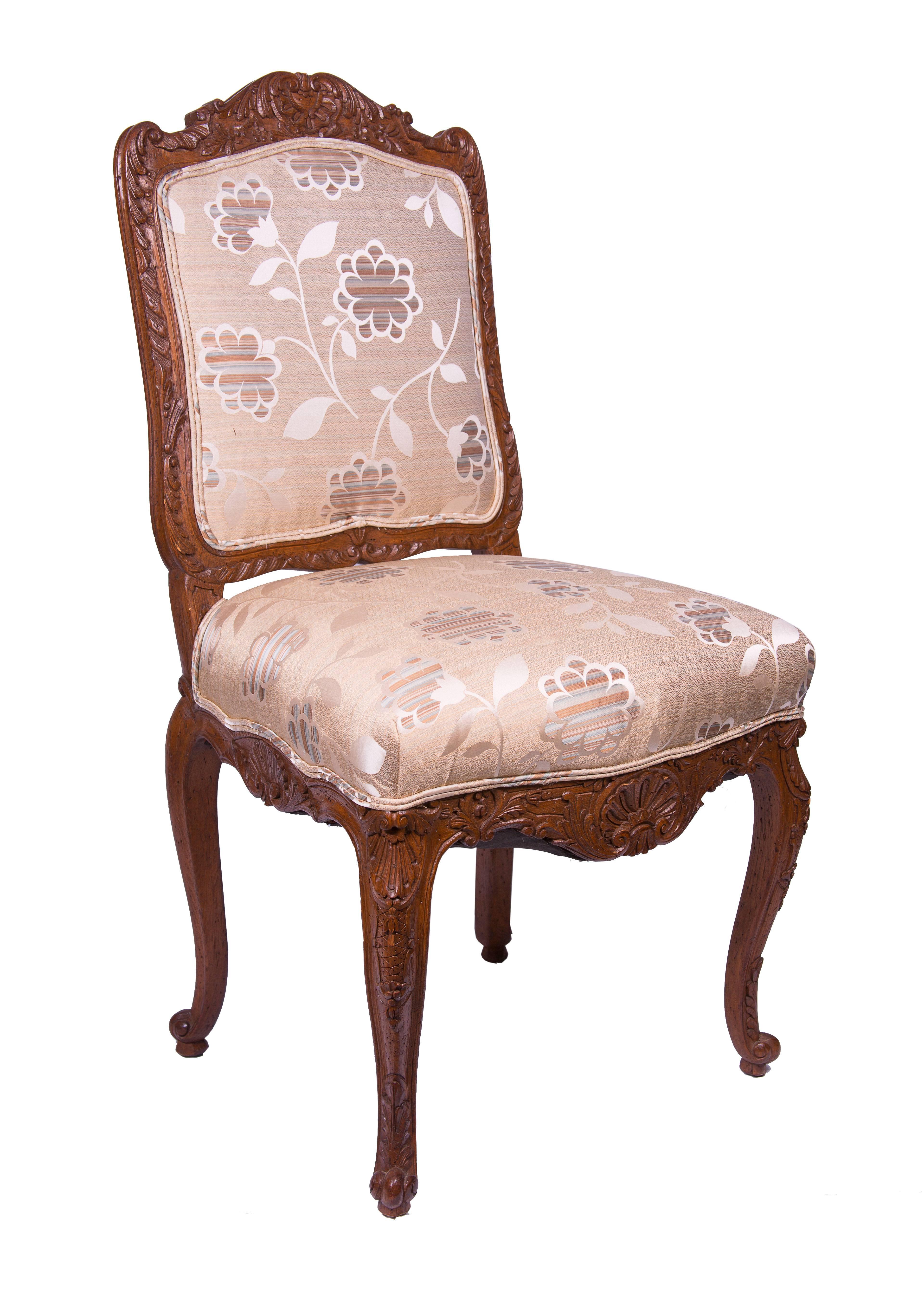 Set of four oak carved and upholstered Louis XV style side or dining chairs, 19th century.
