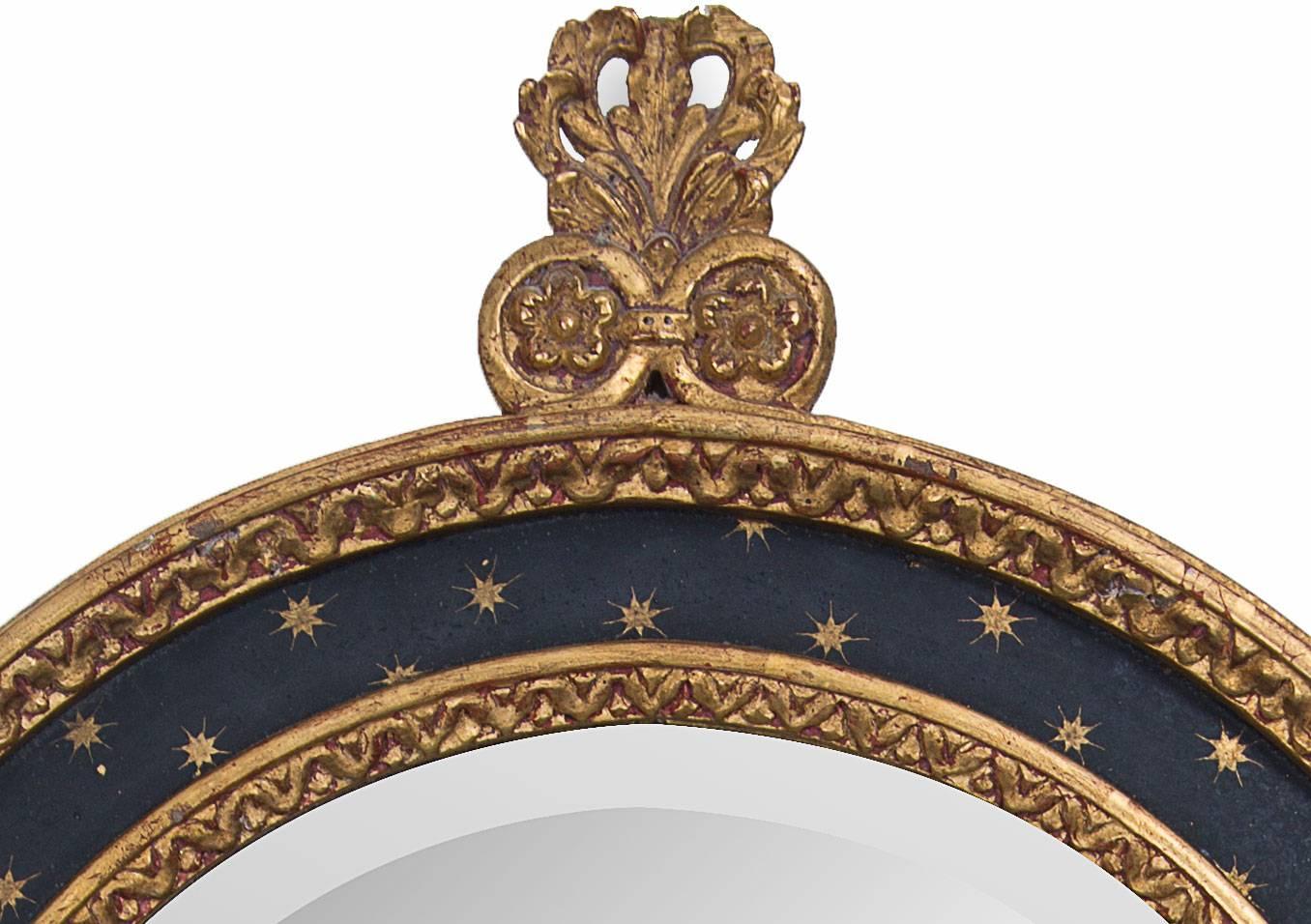 Renaissance Italian Ebonized and a Parcel-Gilt Mirror
