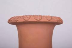 Pair of Neoclassical Terracotta Urns on Decorated Plinths