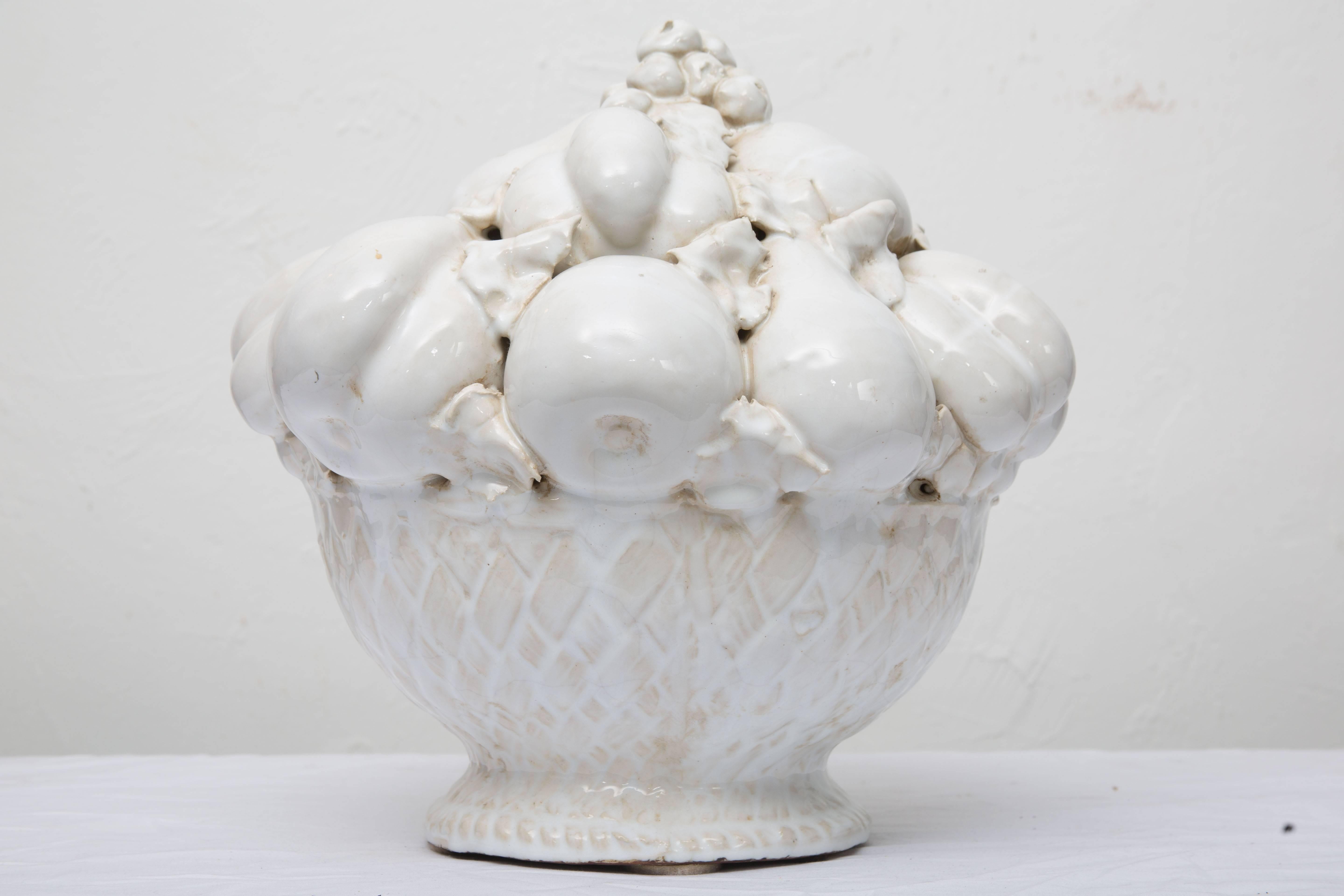 This Italian large-scale white glazed fruit basket offers a decorative yet subtle and striking accent, circa early 20th century.