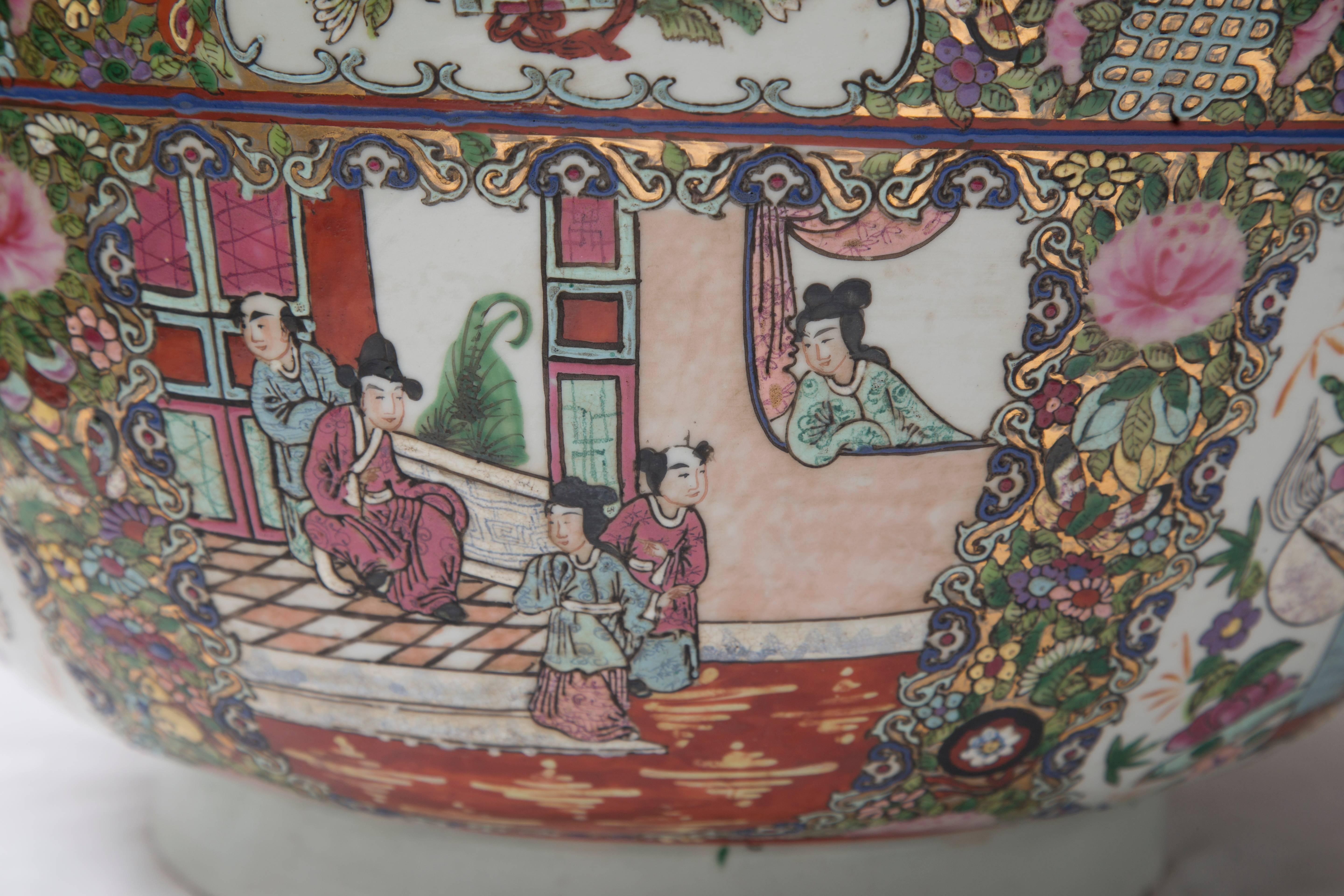 This is a Classic Chinese punch bowl with mandarin court scenes and a variety of decorative panels, inside and out, 20th century.