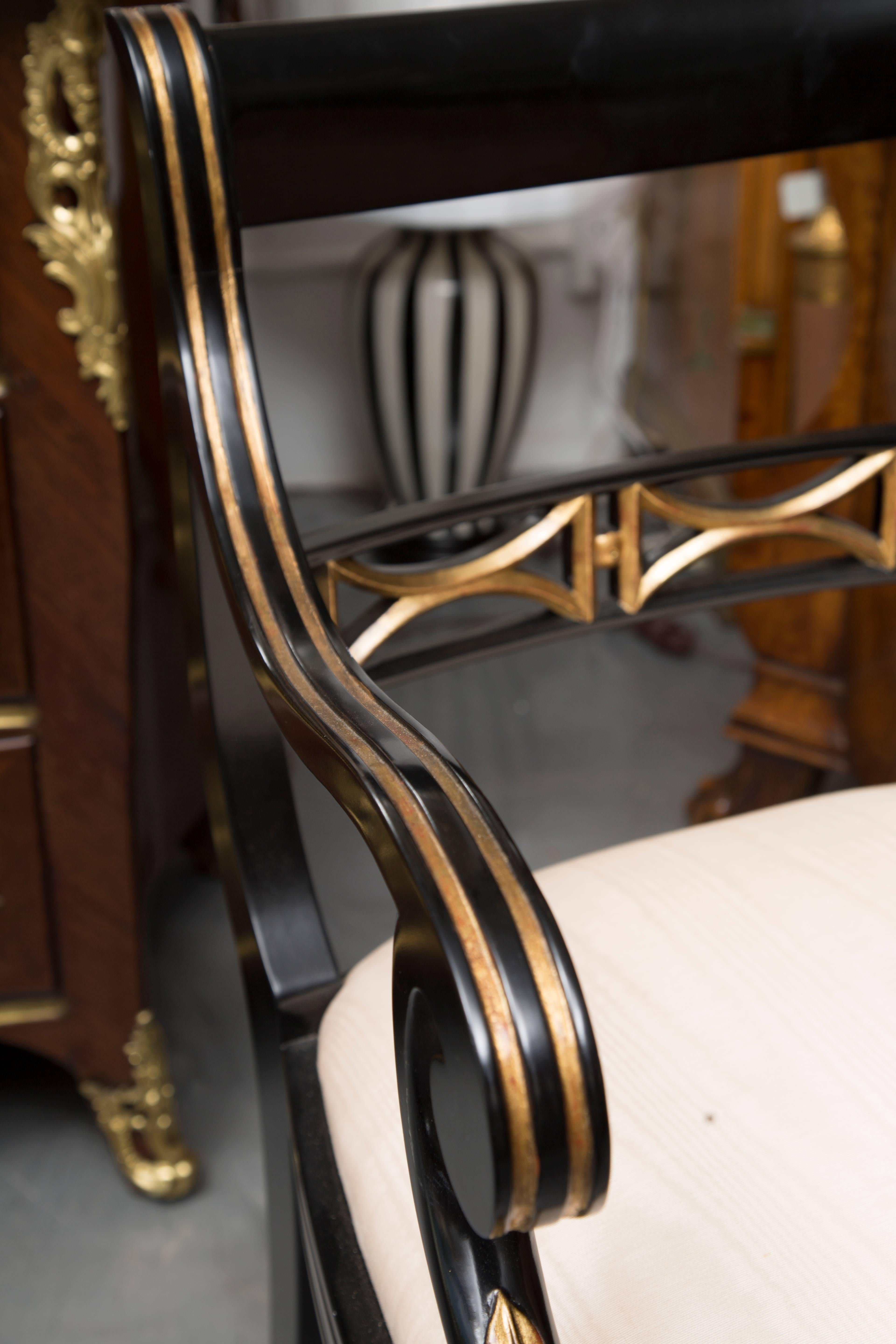 20th Century Pair of Regency Style Ebonized and Parcel Gilt Armchairs