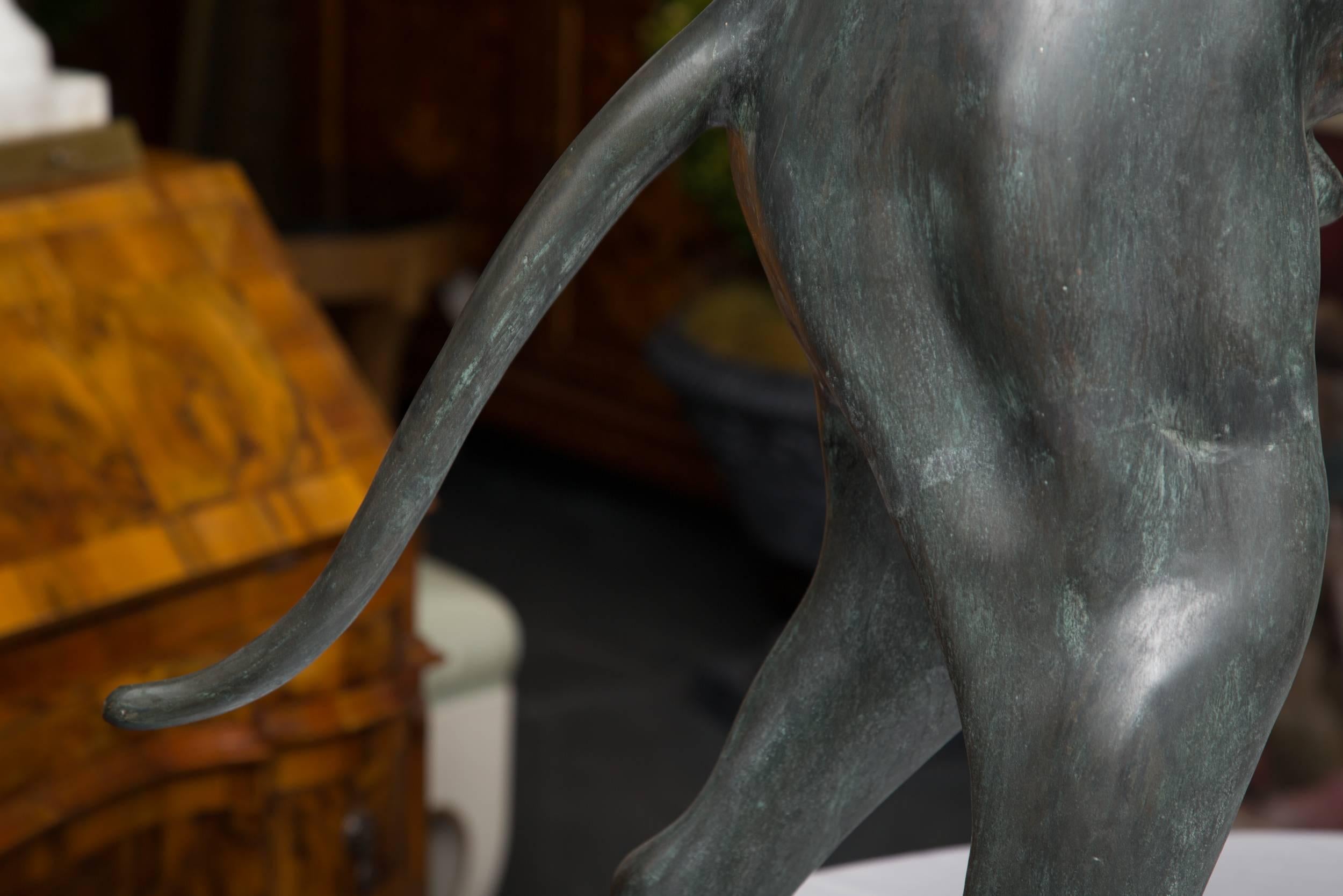 This is an elegant, stately bronzed figure of a Whippet, 20th century.