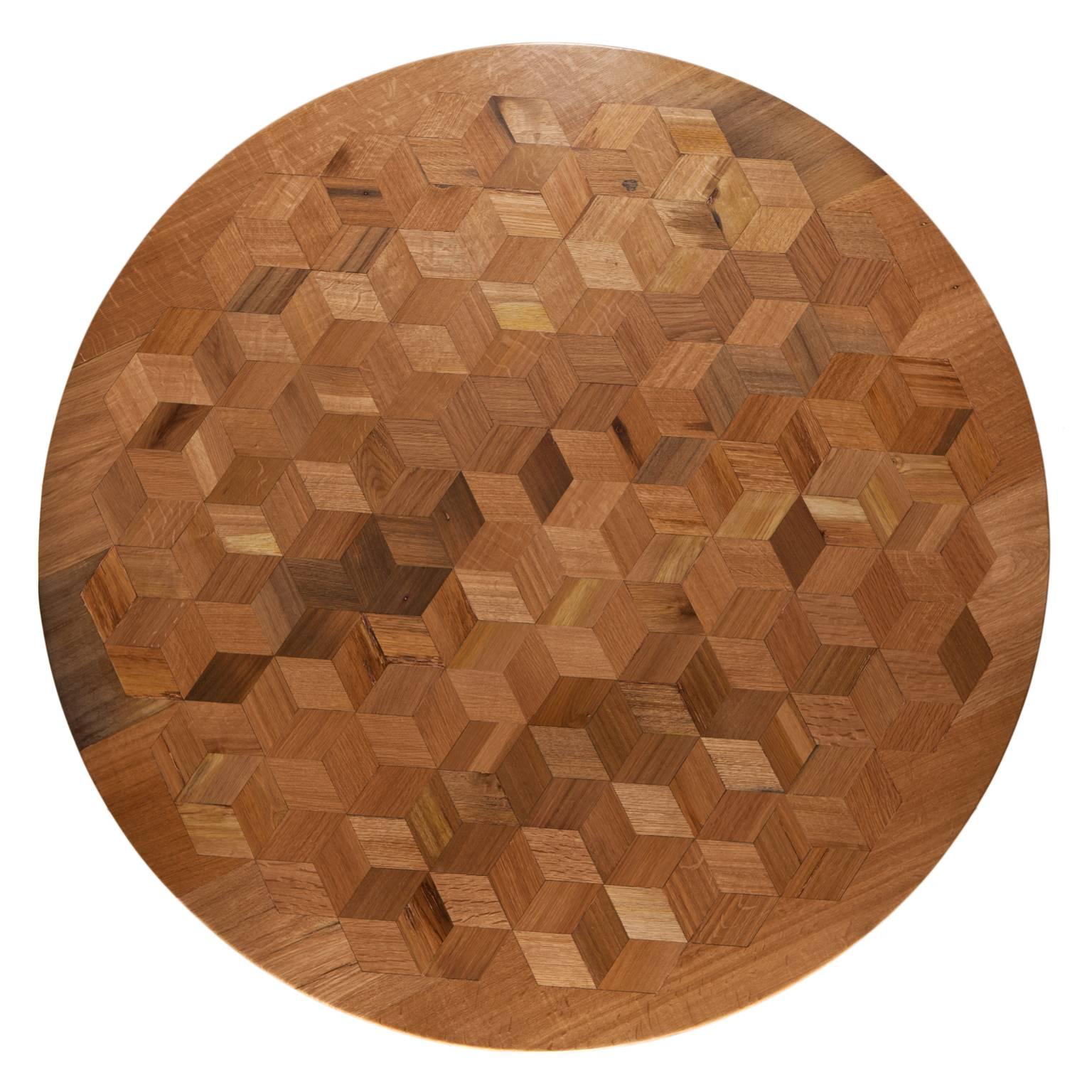 Inspired by the work of Escher, with Maurits we want to prove that a table doesn’t have to be antique to be an impressive testimony of craftsmanship. The marquetry table top in reclaimed Oak contains 222 rhombi cut from old Italian wine barrels. The