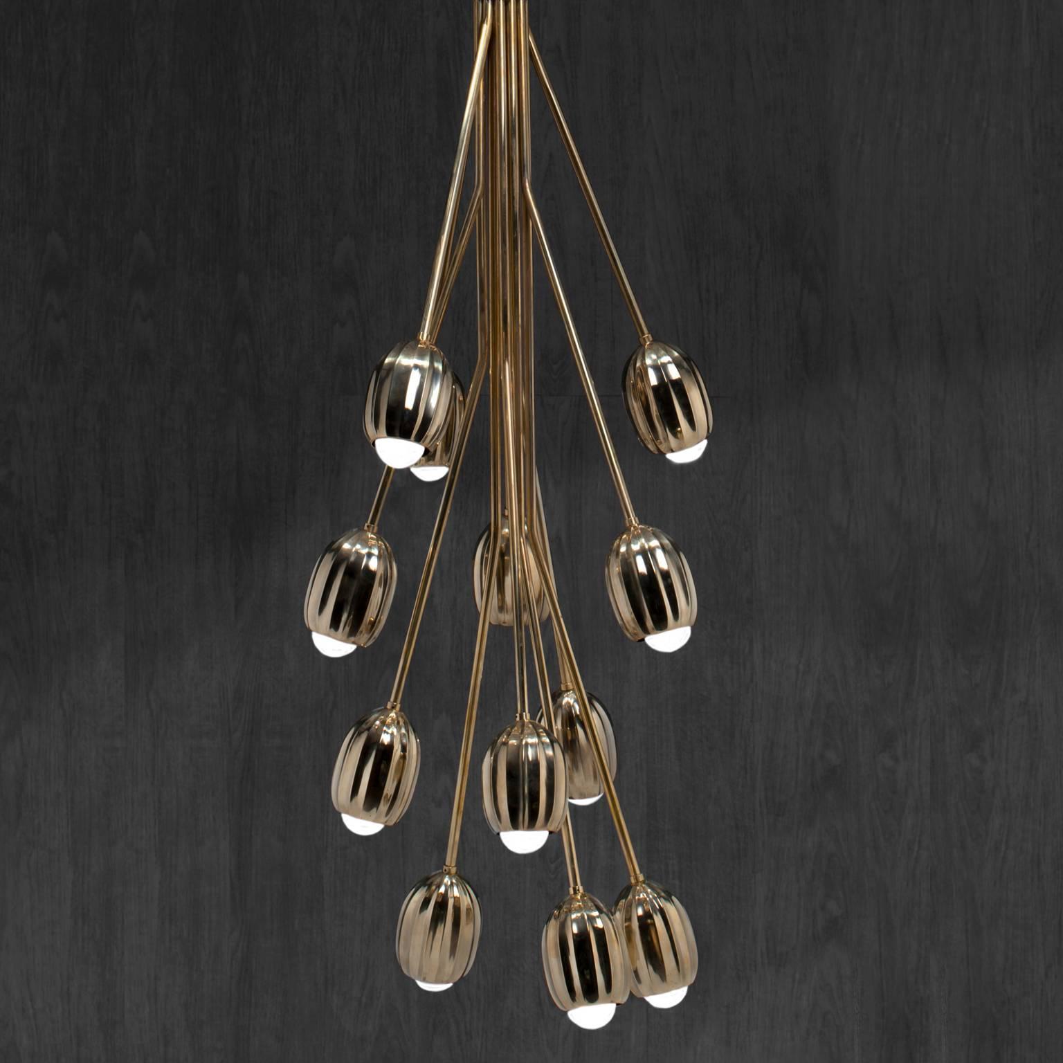 Combining stems that carry the blooming buds, from a couple that looks simply poetic, up to a whole bouquet that appears extravagantly scenic. Lost wax cast by master craftsmen in Tuscany, Italy. 
This listing is for a brass chandelier composed of