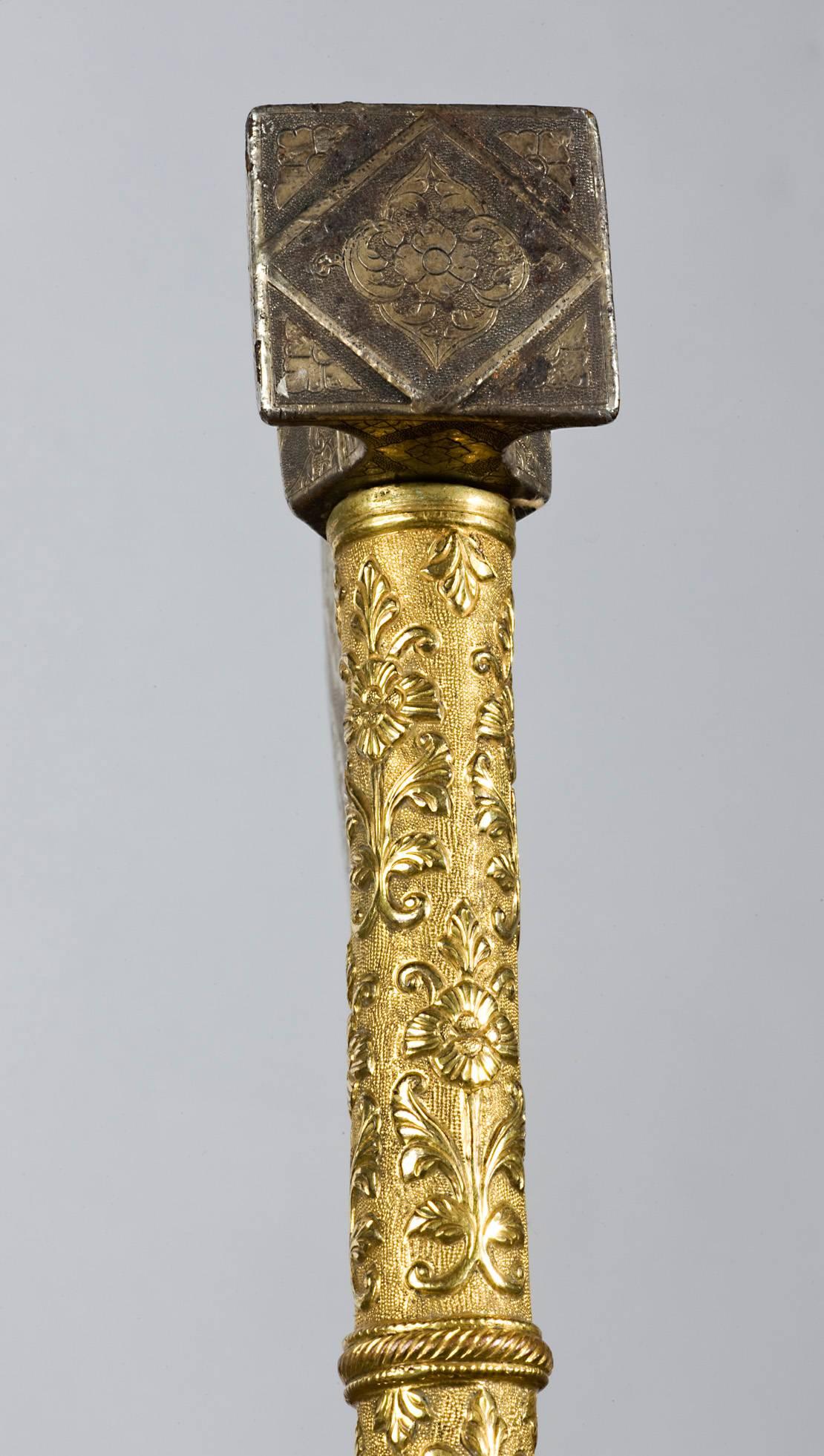 An 18th-19th century Indian important and high quality axe with gilt bronze handle, watered steel blade featuring beautiful gold carvings on its blade.