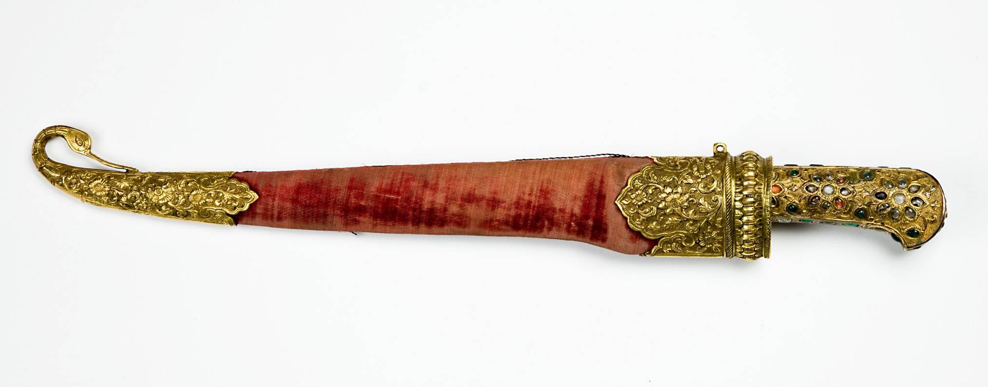 A 19th century Mughal gilt silver dagger with precious stones and water steeled blade.