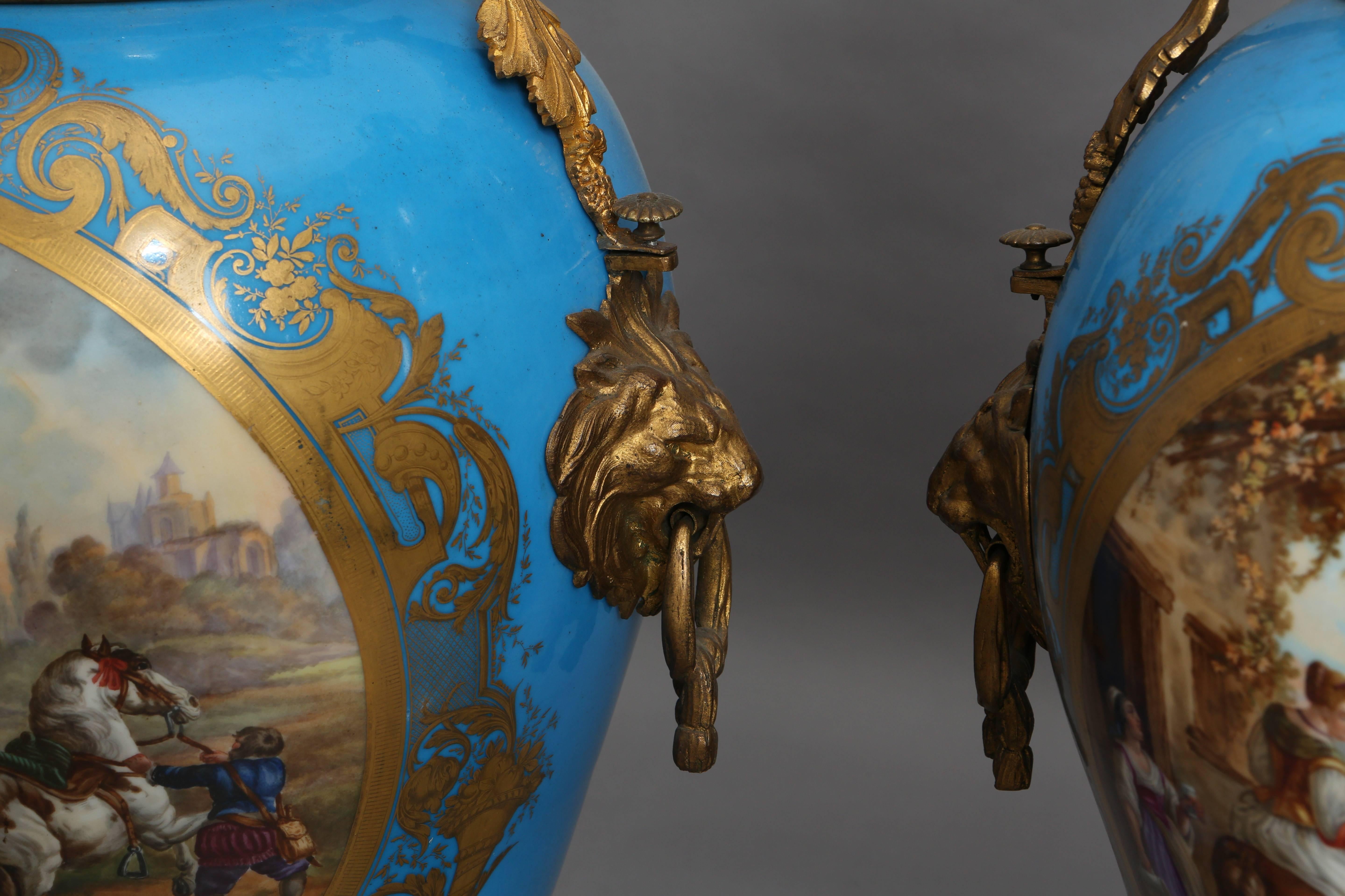 A pair of sky blue 19th century Sèvres style vases depicting hunting scenes and scenes describing the preparation for hunting. They have very special bronze handles featuring lion heads and matching lids. Hand-painted and hand-gilt.
They are marked