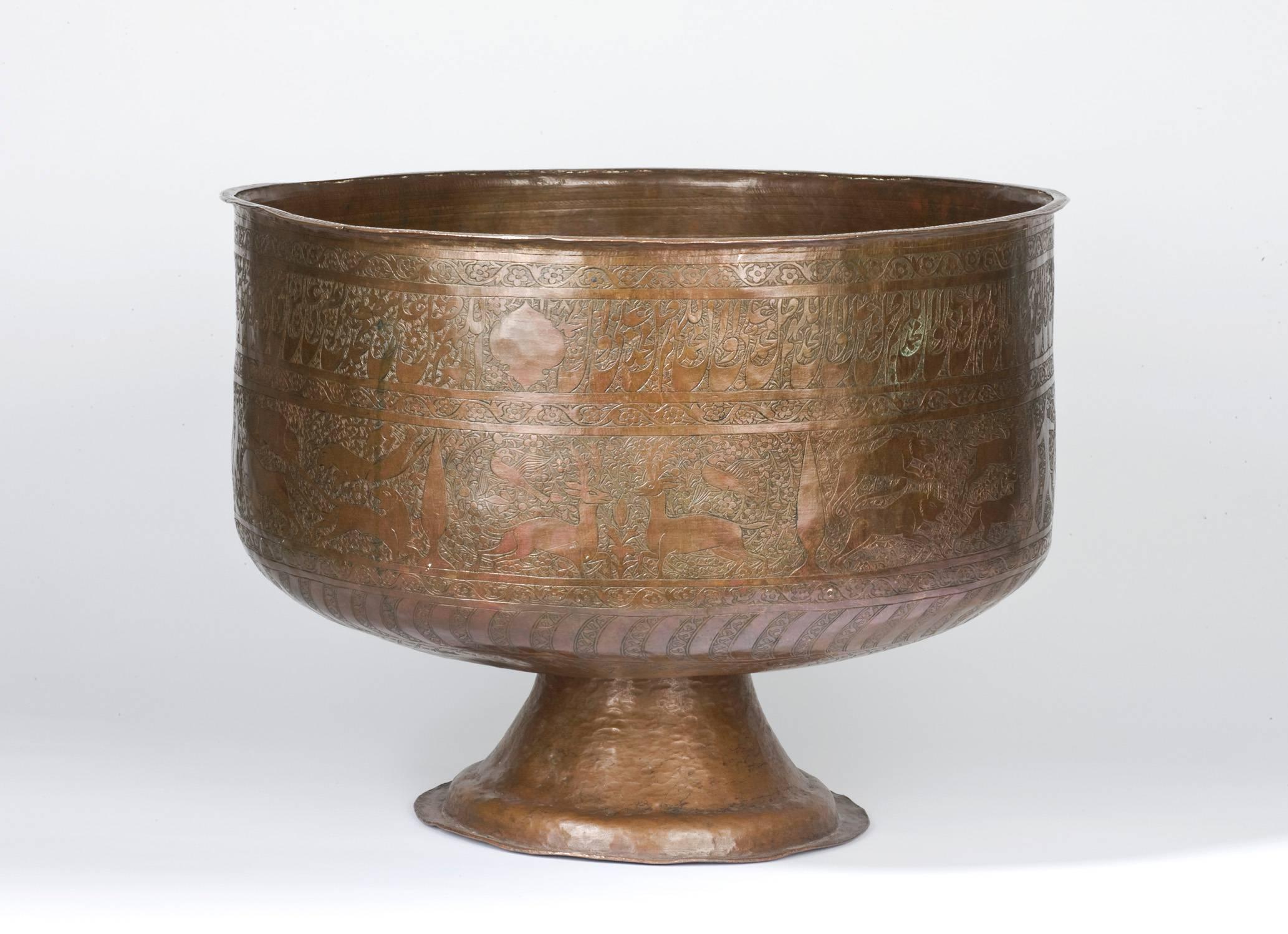 A late 18th century Iranian copper bowl featuring animal motif decoration and Arabic inscriptions. It depicts elephants, birds and felines attacking gazelles. The material used is copper, it is a very fine handcrafted work of art.
Dated 1787 to the