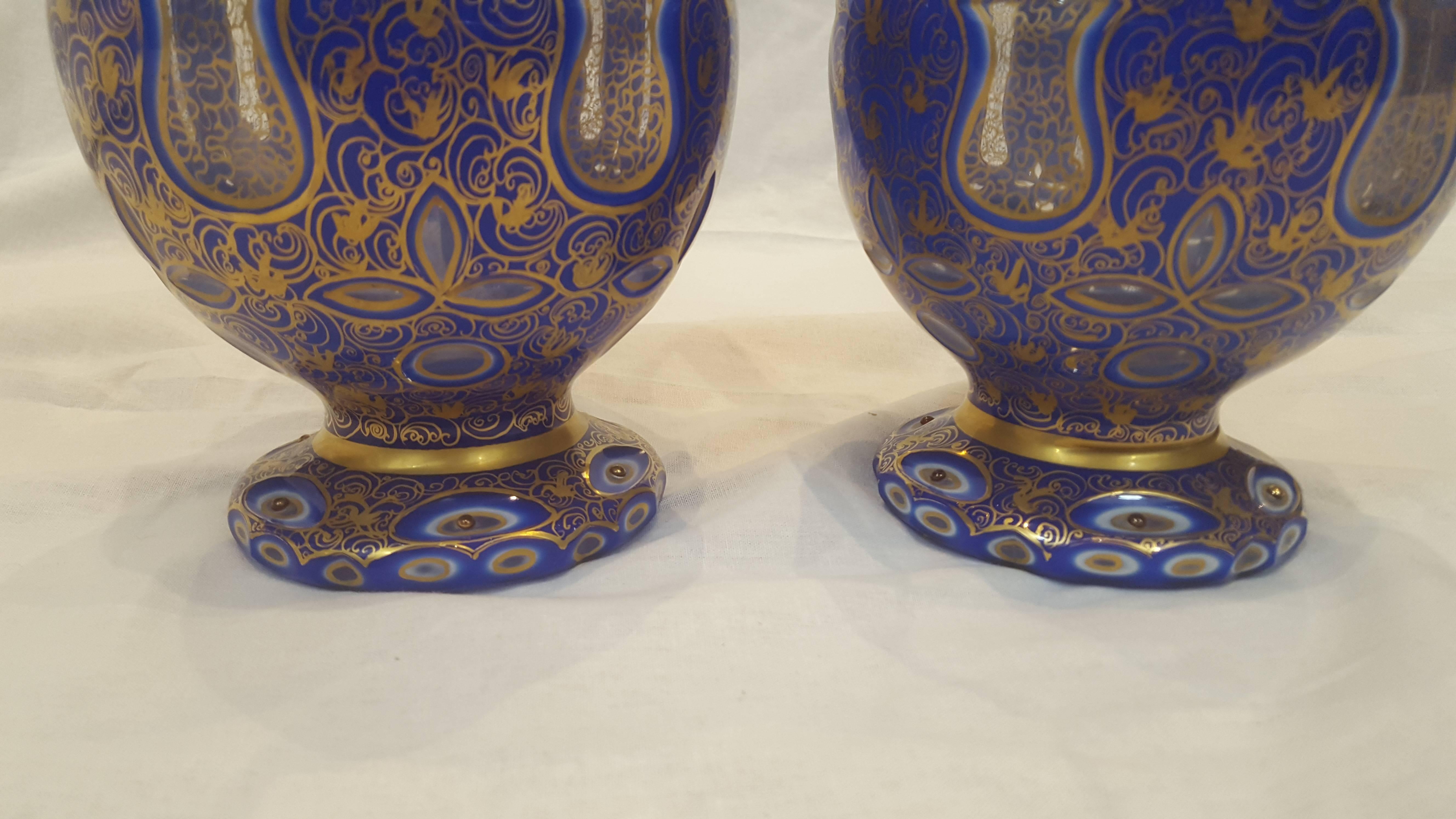 Cut Glass Pair of 19th Century Bohemian White and Blue-Overlay Gilt Glass Ewers For Sale