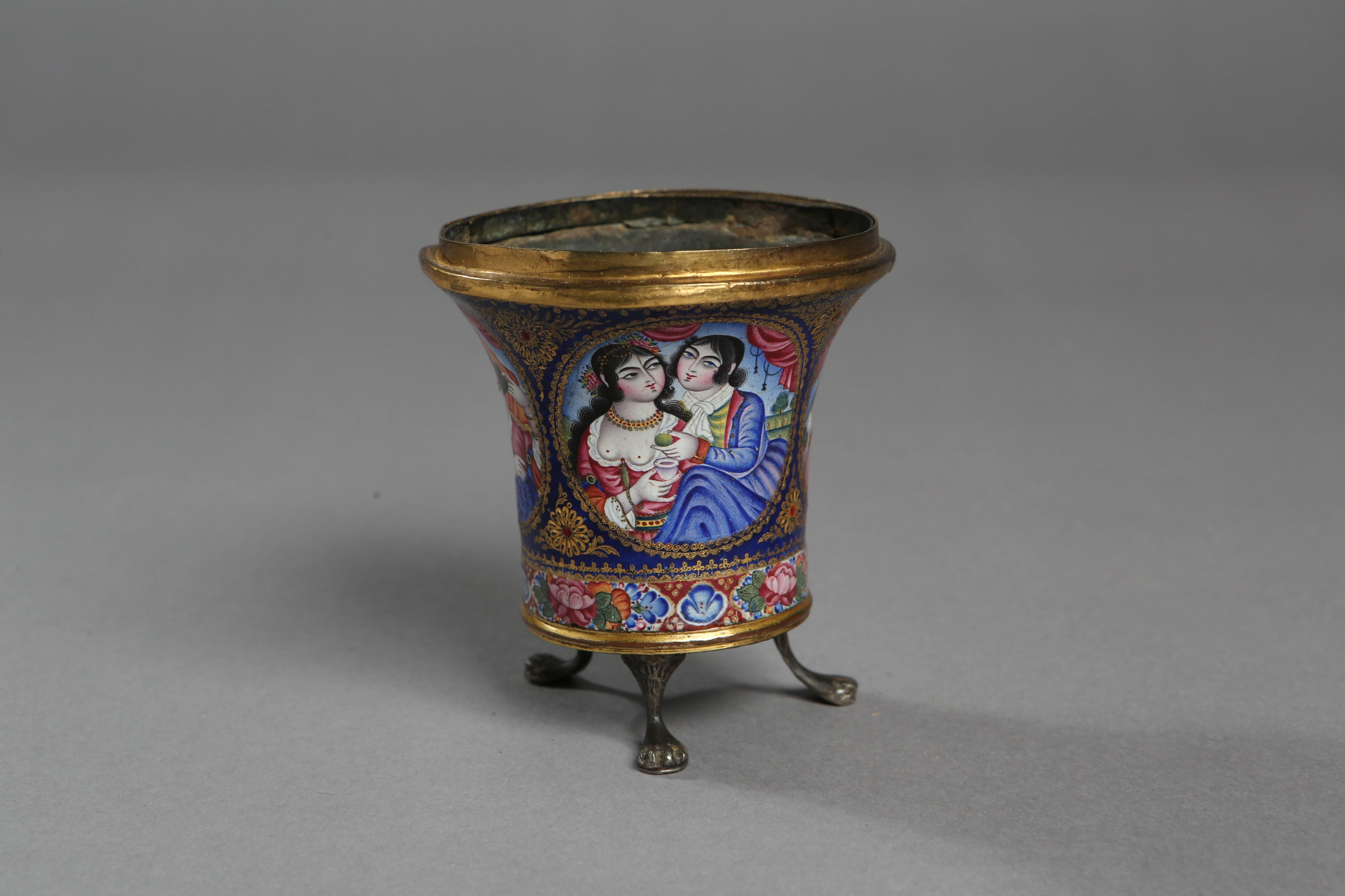 A very high quality of enamel is used in the creation of this Iranian qajar dating back to the 19th century. The richness in iconography; the use of the characteristic exuberant style; and the vibrant use of colours and the typical rose motives were