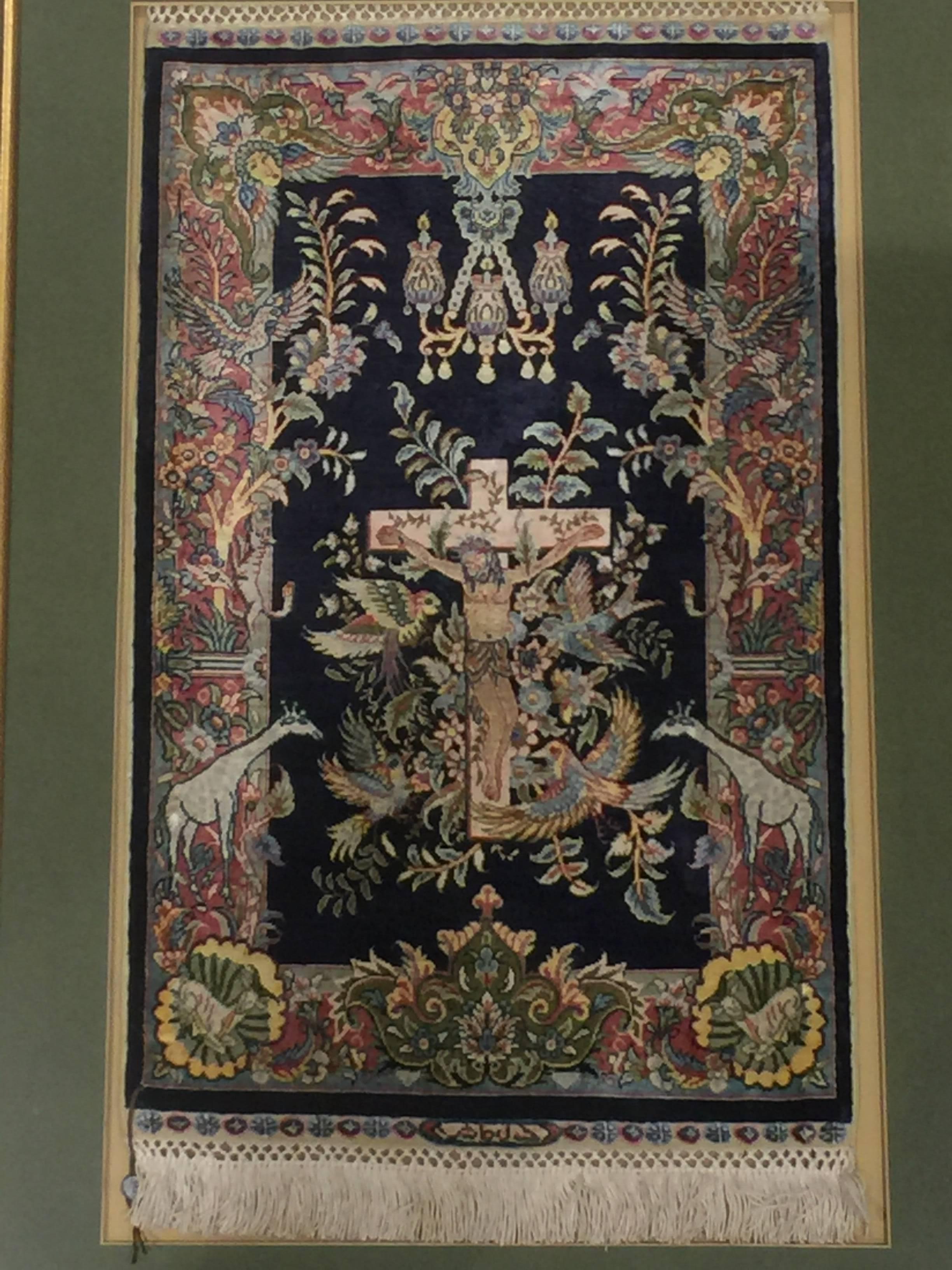 Turkish Hereke pure silk hand-knotted carpet, very fine quality, measures 15 x 15 knots each centimetre.
It features various animals (lamb, birds, giraffe, etc.) and floral motifs with a central depiction of the crucified Jesus Christ.

Hereke