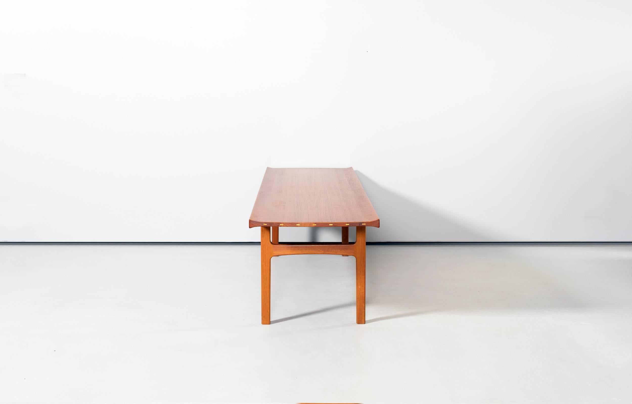 An great example of Danish craftsmanship, wonderful coffee table or bench made of solid teak with nice details. Distributed or sold at Illums Bolighus Copenhagen, Denmark in the 1960s. Made by AB Seffle Møbelfabrik. Minor wear consistent with age