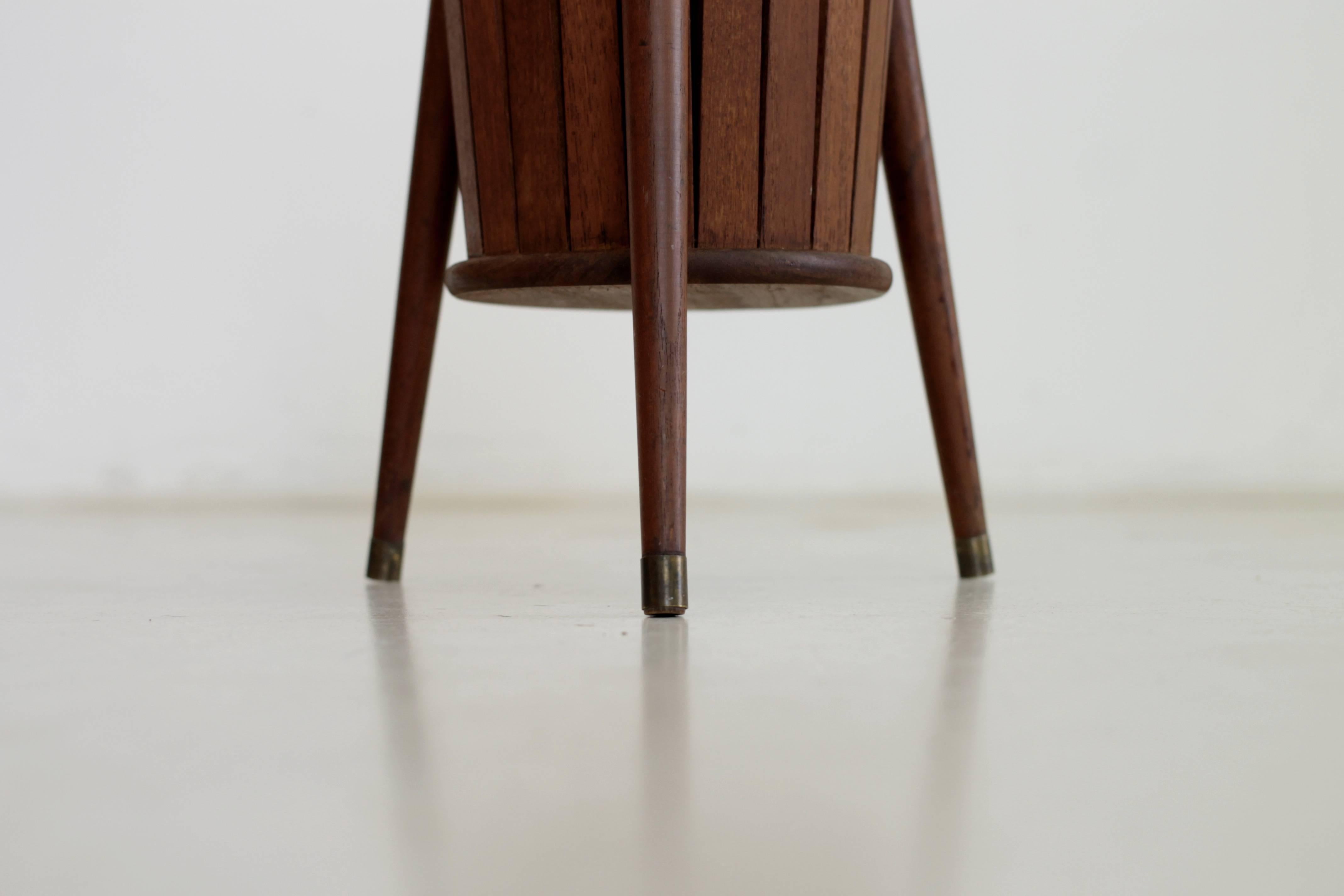 Tripod Danish umbrella stand made from teak and brass in excellent condition.