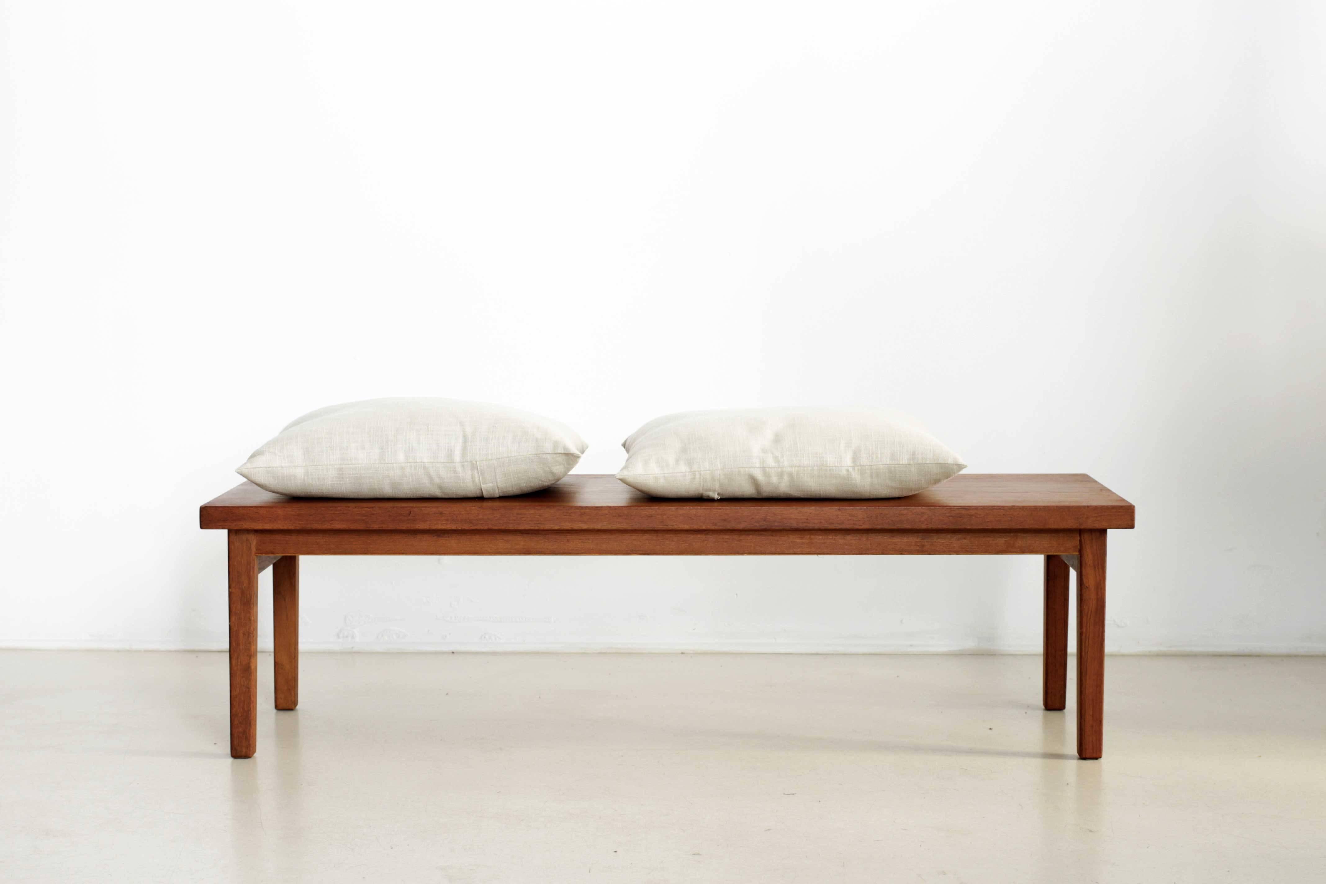 Modernist scandinavian coffee table made of teak. Can be also used as a bench.