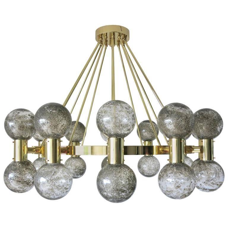 Italian modern Murano chandelier shown in smoky Murano bollicine glass globes and polished brass finish
24 lights / max 40W each
Diameter: 47 inches / Height: 37 inches
2 currently in stock ready to ship from Italy / Made in Italy 
Please inquire