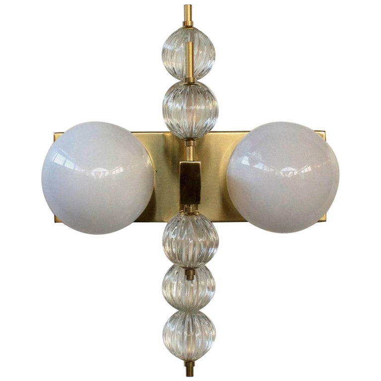 Italian wall light with glossy white Murano glass globes, mounted on polished brass frame / Designed by Fabio Bergomi for Fabio Ltd / Made in Italy
2 lights / E12 or E14 type / max 40W each
Height 18 inches / Width 14 inches / Depth 8.5 inches
Order