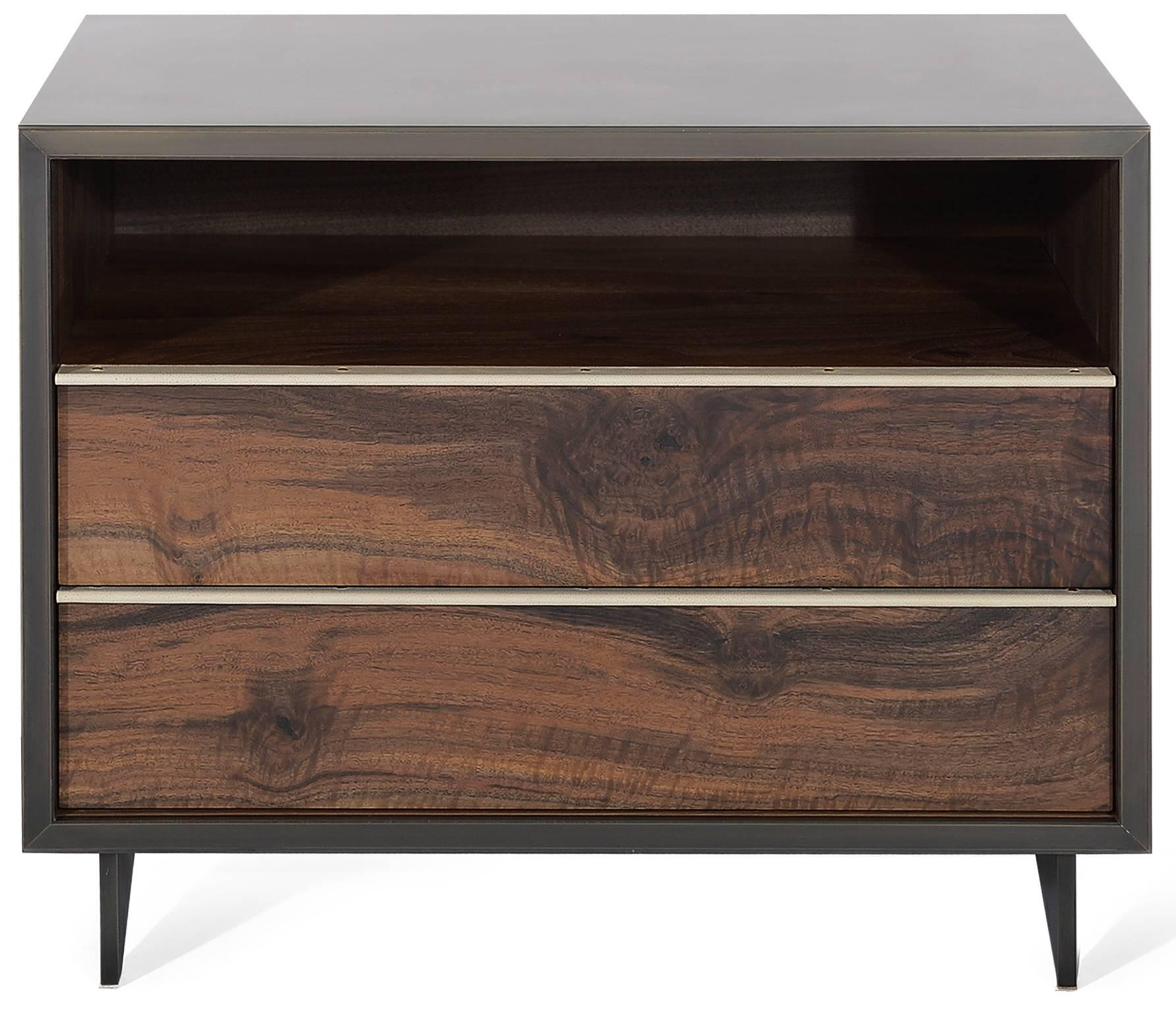 The elegant Tompkins end table has a darkened bronze encased in Epoxy Resin exterior with Claro walnut doors and interior and custom stingray leather pulls. The end table sits atop a blackened cold rolled steel base. The unique metal encased in