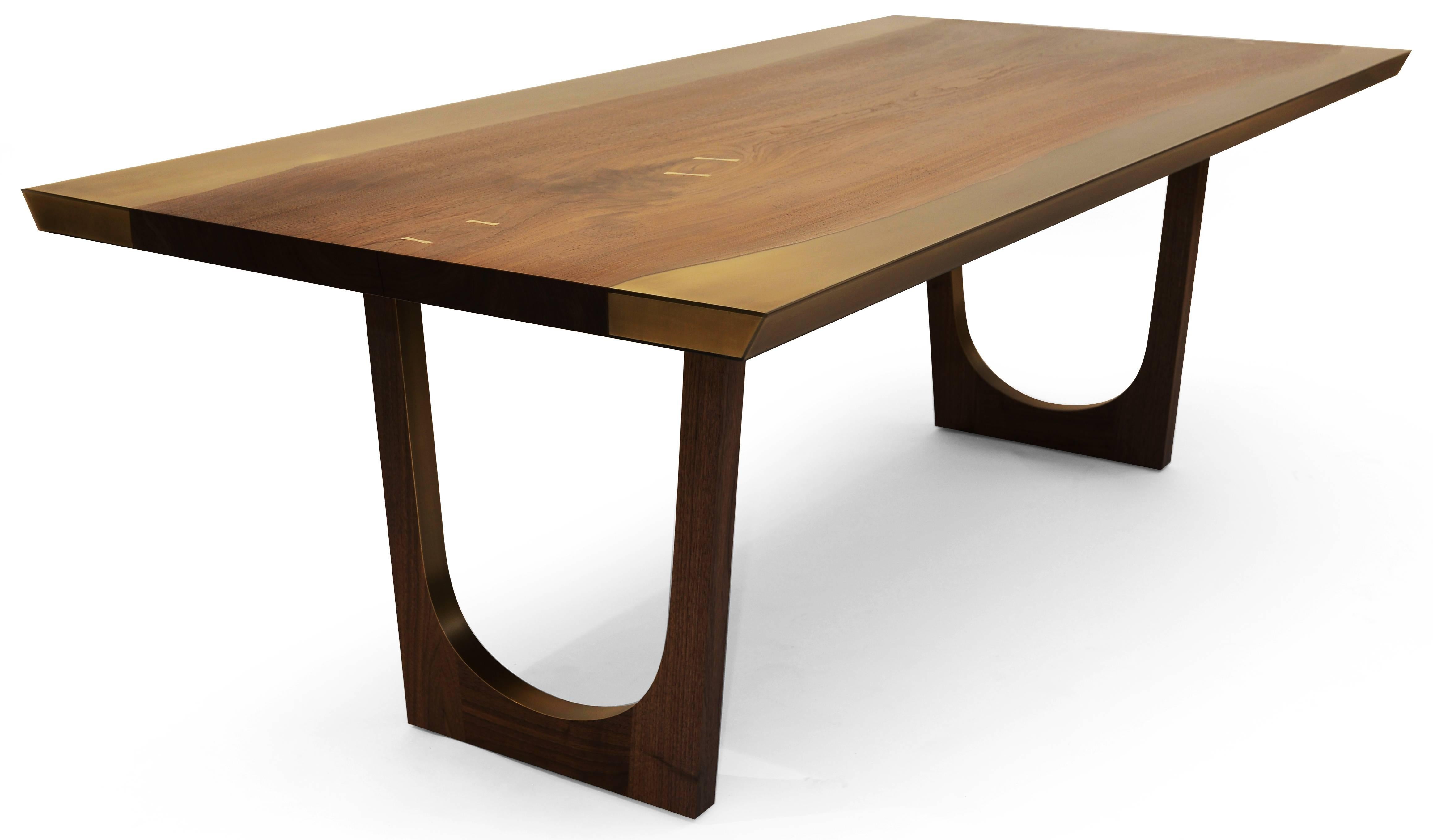 The striking and beautiful Nola dining table is our take on the live-edge style table. The table features a hand-picked solid slab of black walnut flanked by Bronze encased in Epoxy Resin sides that have been cut with precision and flawlessly