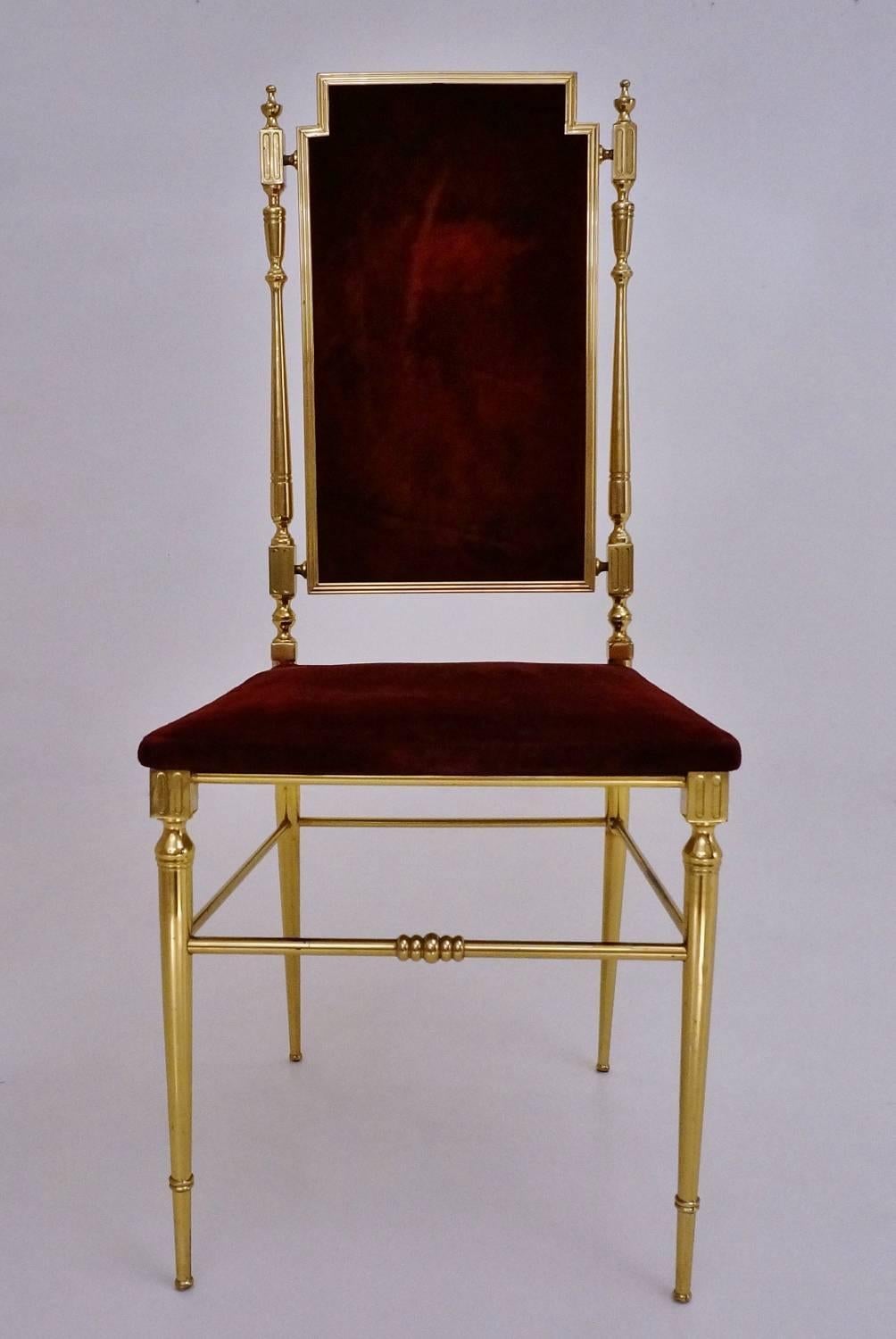 Neoclassical brass chair with original scarlet red velvet upholstery, French, circa 1950s.

This vintage chair has been thoroughly cleaned respecting the original antique patina on the brass, and is ready to use.

This neoclassical design is a
