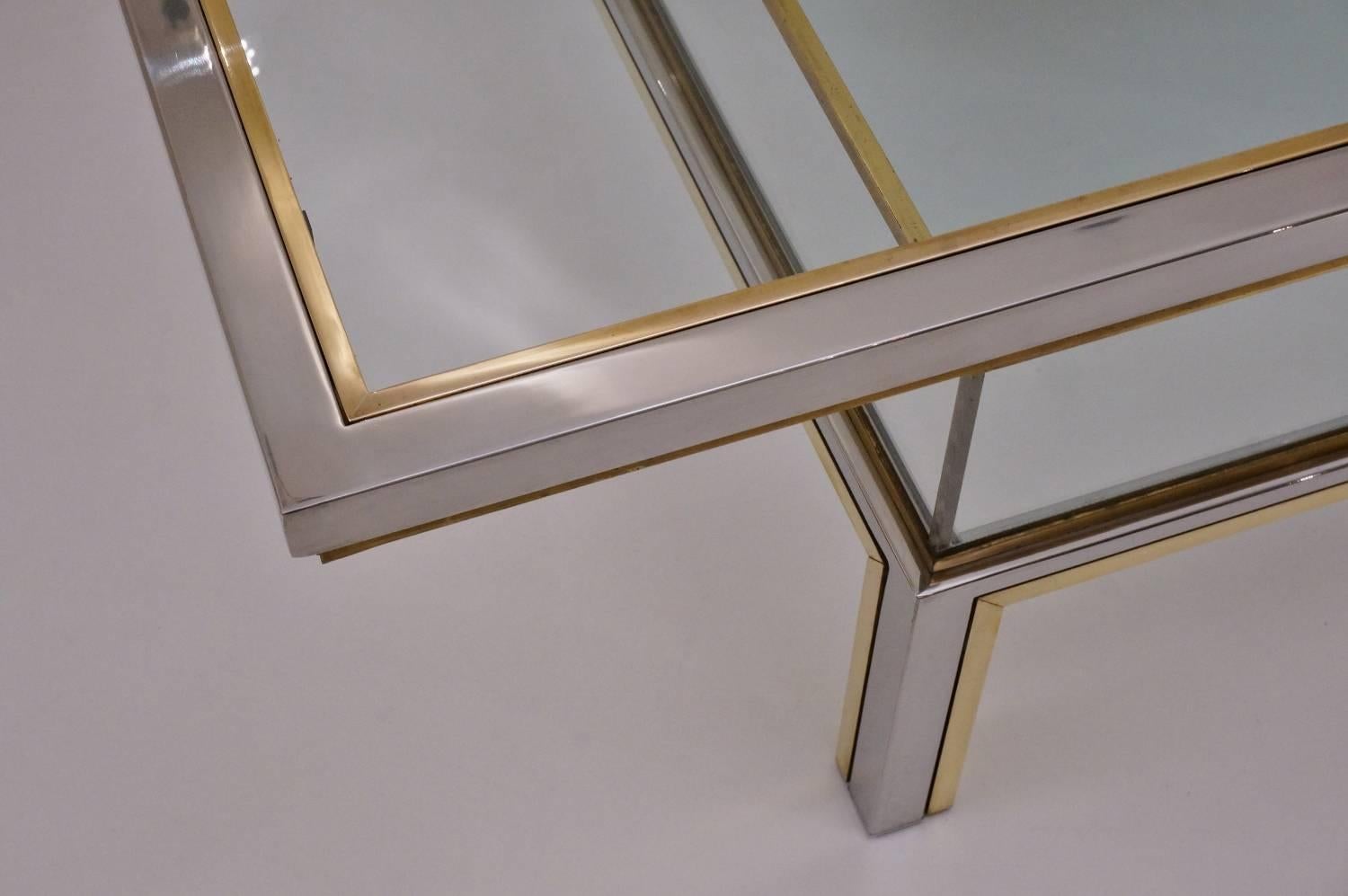 Romeo Rega signed vintage coffee table with a sliding top and display shelf in brass, chrome, Lucite and glass, circa 1970s, Italian.

Thoroughly cleaned respecting the vintage patina and ready to use.

This generous sized square coffee table by