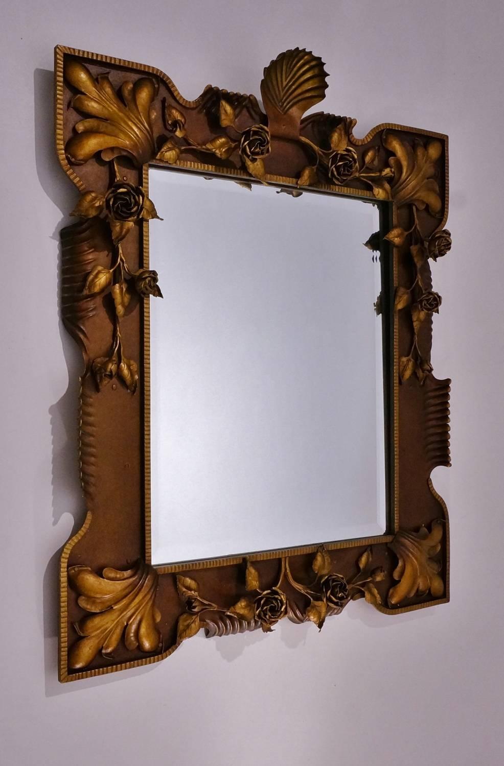 Italian floral gilded tole mirror, neoclassical frame with 12 handmade metal roses, circa 1940s.

This mirror has been thoroughly cleaned while respecting the antique patina.

This unique 1940s wall mirror with a border of tole metal roses is
