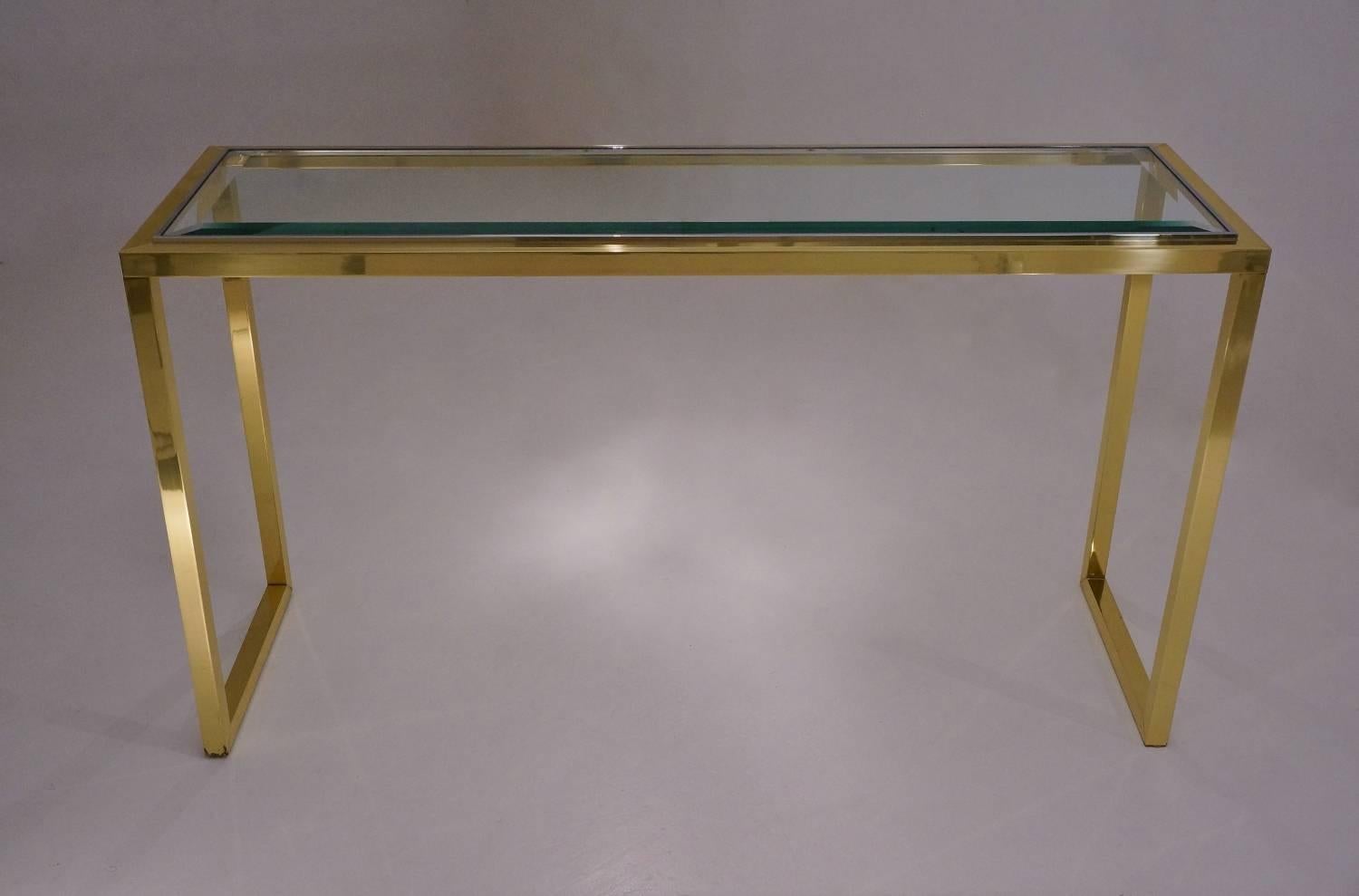 Willy Rizzo console table in brass, chrome and glass, circa 1970s, Italian.

This console has been thoroughly cleaned respecting the original lacquer and antique patina. It is ready to use. 

This Modernist console table is attributed to Italian