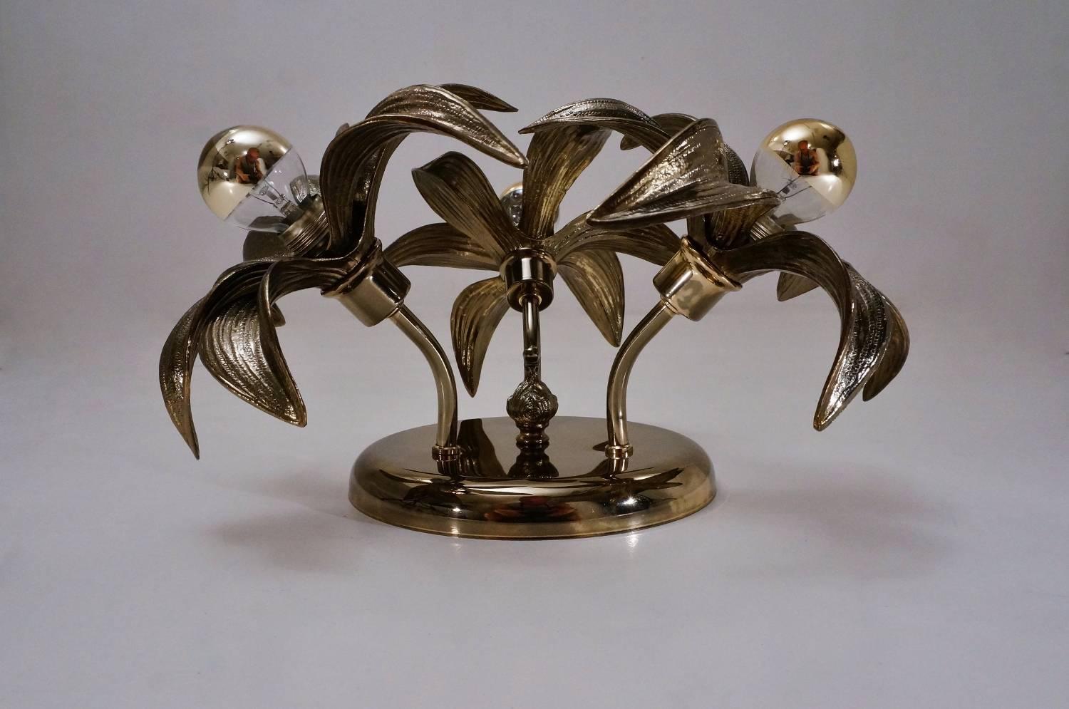 Brass flower light with three flowers in the style of the famous designer Willy Daro. These lights are by Massive Lighting, circa 1970s, Belgian.

Thoroughly cleaned, fully rewired, in full working order and ready to use.

This vintage ceiling light