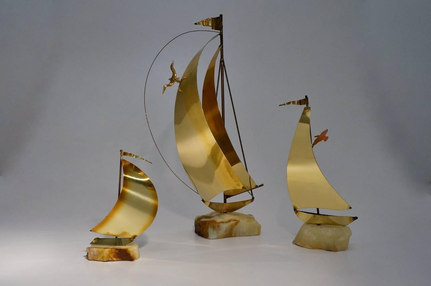 DeMott boat sculptures, set of four, brass on onyx or wood base, American, circa 1970s.

These four vintage sculptures have been gently cleaned while respecting the aged patina.

John and his brother Don DeMott were discovered by Macy’s