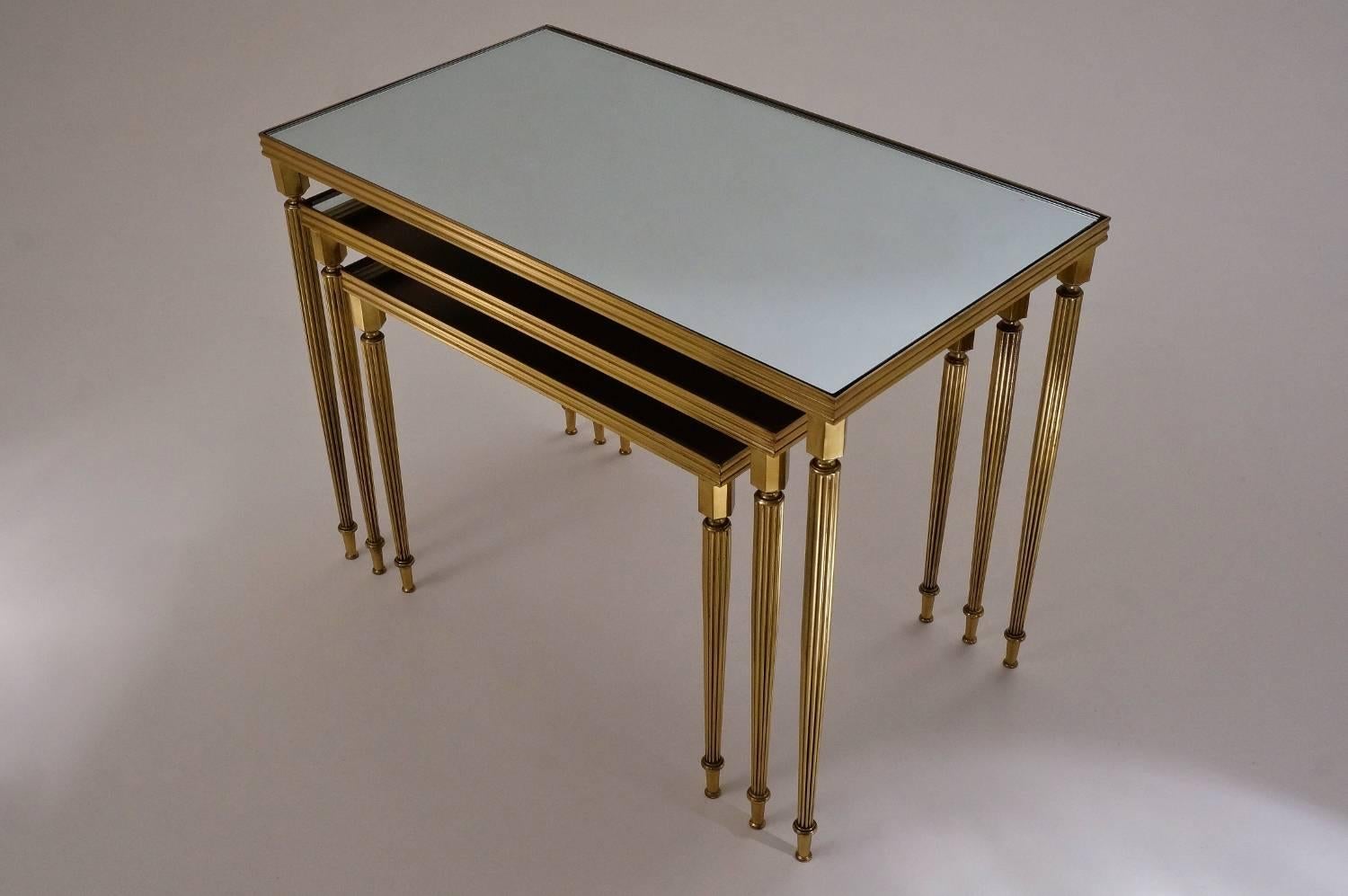 Maison Baguès nesting tables (in the style of), brass and mirror, 1969, French

This set of tables have been gently cleaned respecting the vintage patina; they are ready to use.

The neoclassical and modernist features executed in solid polished
